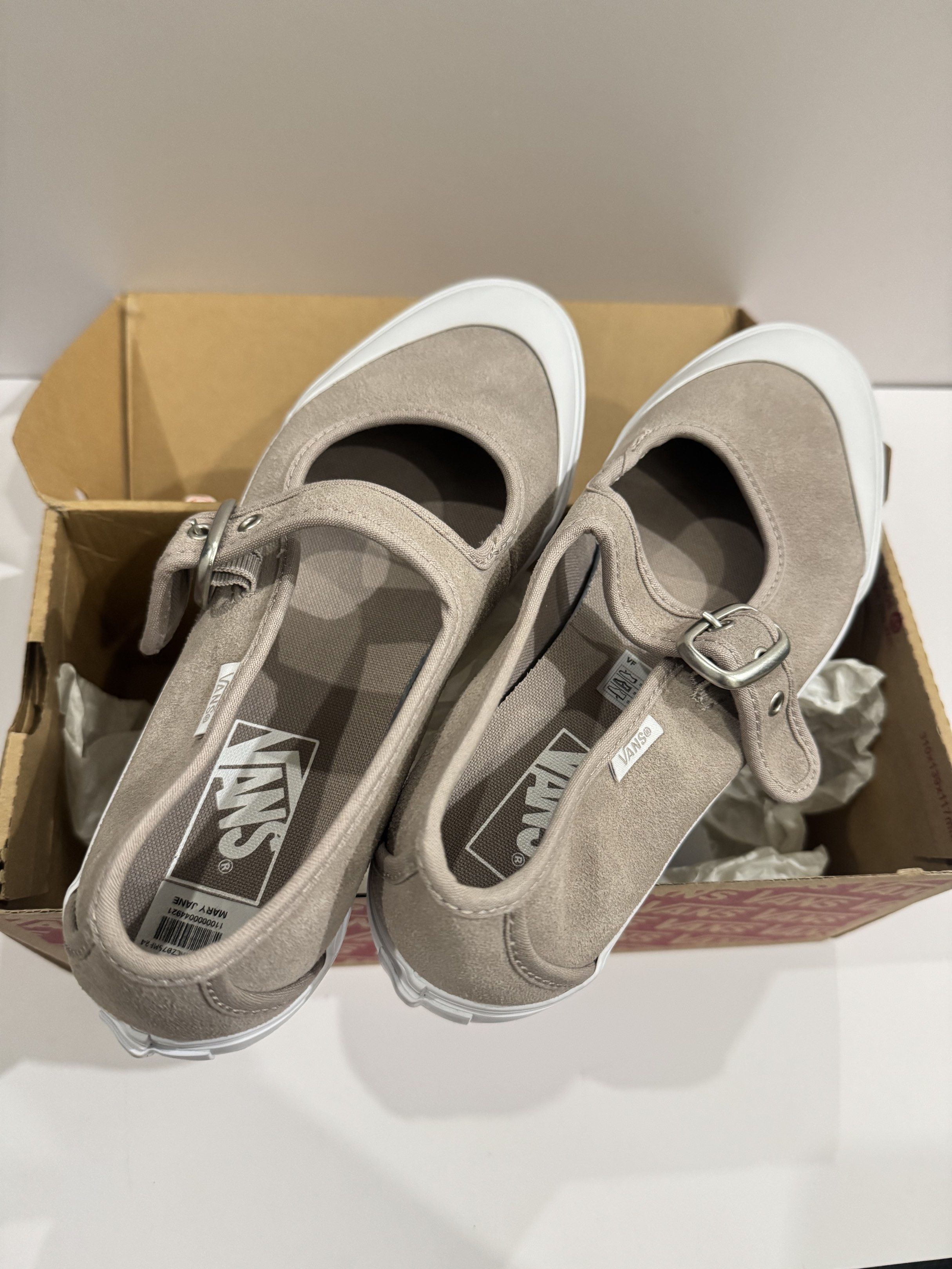 Vans Mary Jane Shoes (Category: Sneakers) located in San Pedro. Submitted by plusizzforless.ph (Listing ID 1420141068, Image 1). Description: - Vans Mary Jane shoes BRAND NEW - Neutral beige color - White toe cap - Buckle strap closure - Size: US 9.5, UK 7, EUR 40, 25.5 cm - Includes original box - Vans logo on insole.