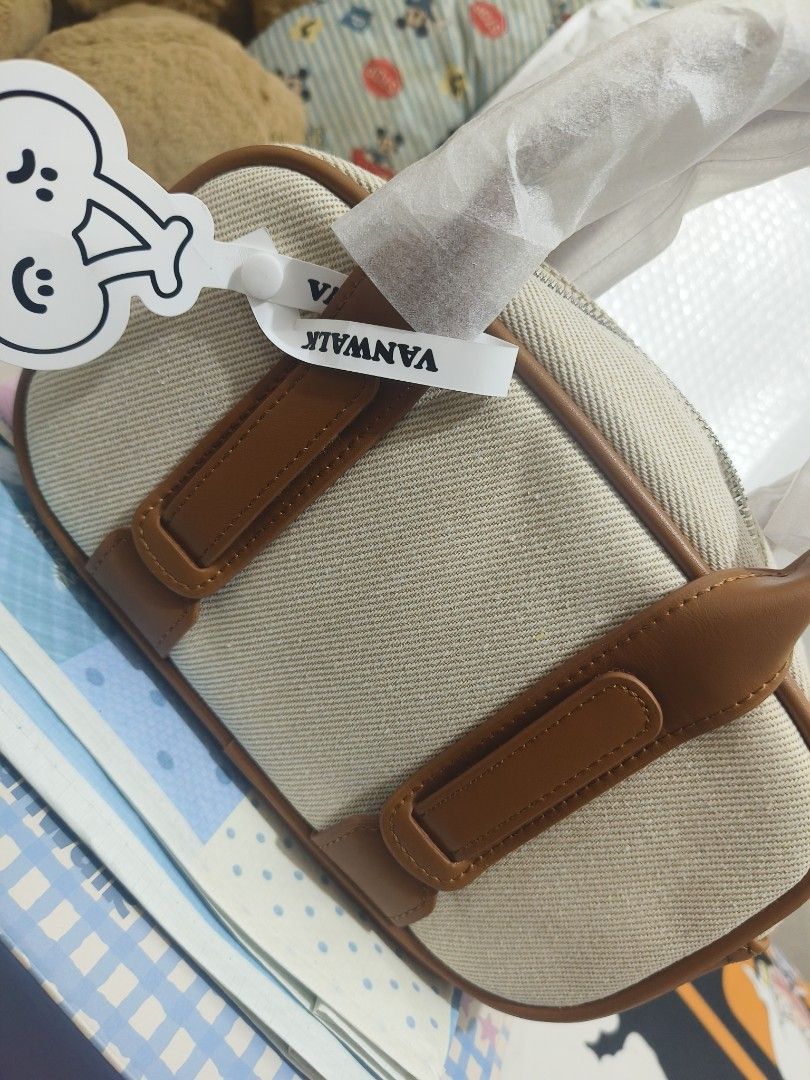 Vanwalk bag (Category: Luxury Bags & Wallets) located in Bacoor. Submitted by saludagame17959 (Listing ID 1420020681, Image 2). Description: - Brand new Janwalez handbag - Color scheme: Beige and brown - Design: Top handle, rectangular shape - Condition: Unused, handle still wrapped - Includes original brand box - Features small logo on the front.