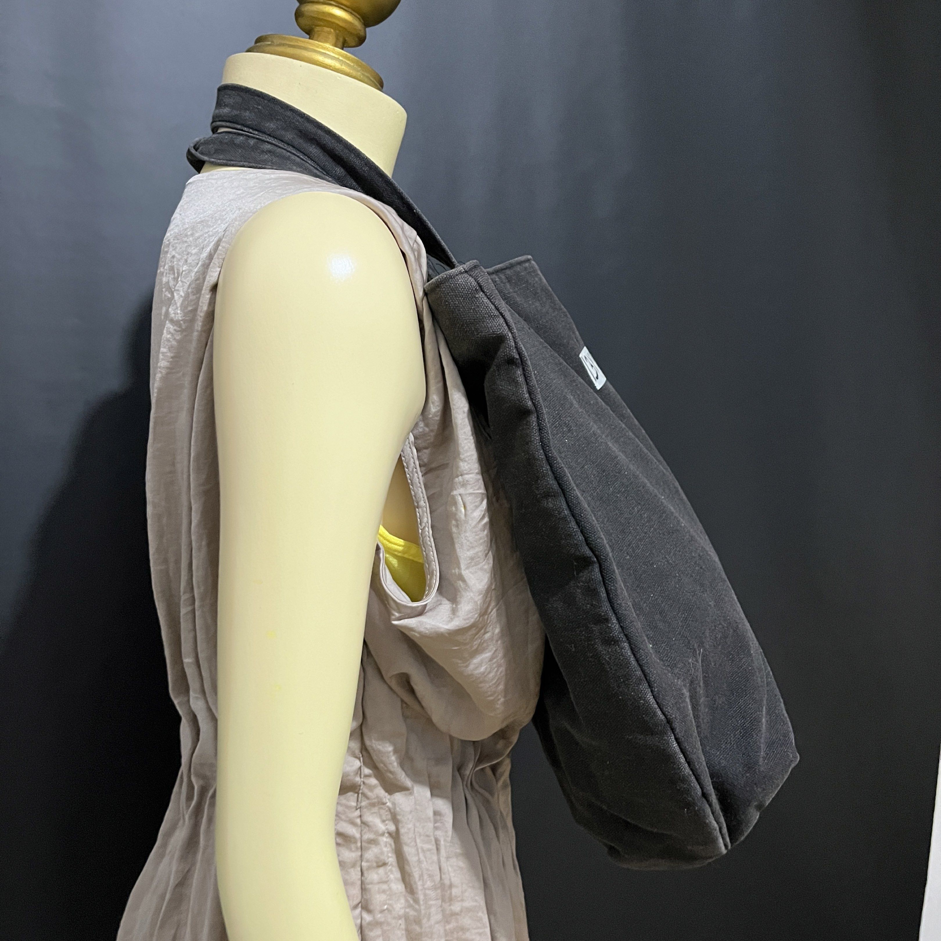 YSL Black Denim Tote Bag (Category: Luxury Bags & Wallets) located in Butuan. Submitted by dfgthriftology2.0 (Listing ID 1420117605, Image 3). Description: - Authentic YSL tote bag - Black denim exterior - Gold embroidered logo - Gold lettering on straps - Pink fabric interior - Interior pocket - Rectangular shape with flat bottom - Dimensions: Approximately 13x13 inches.
