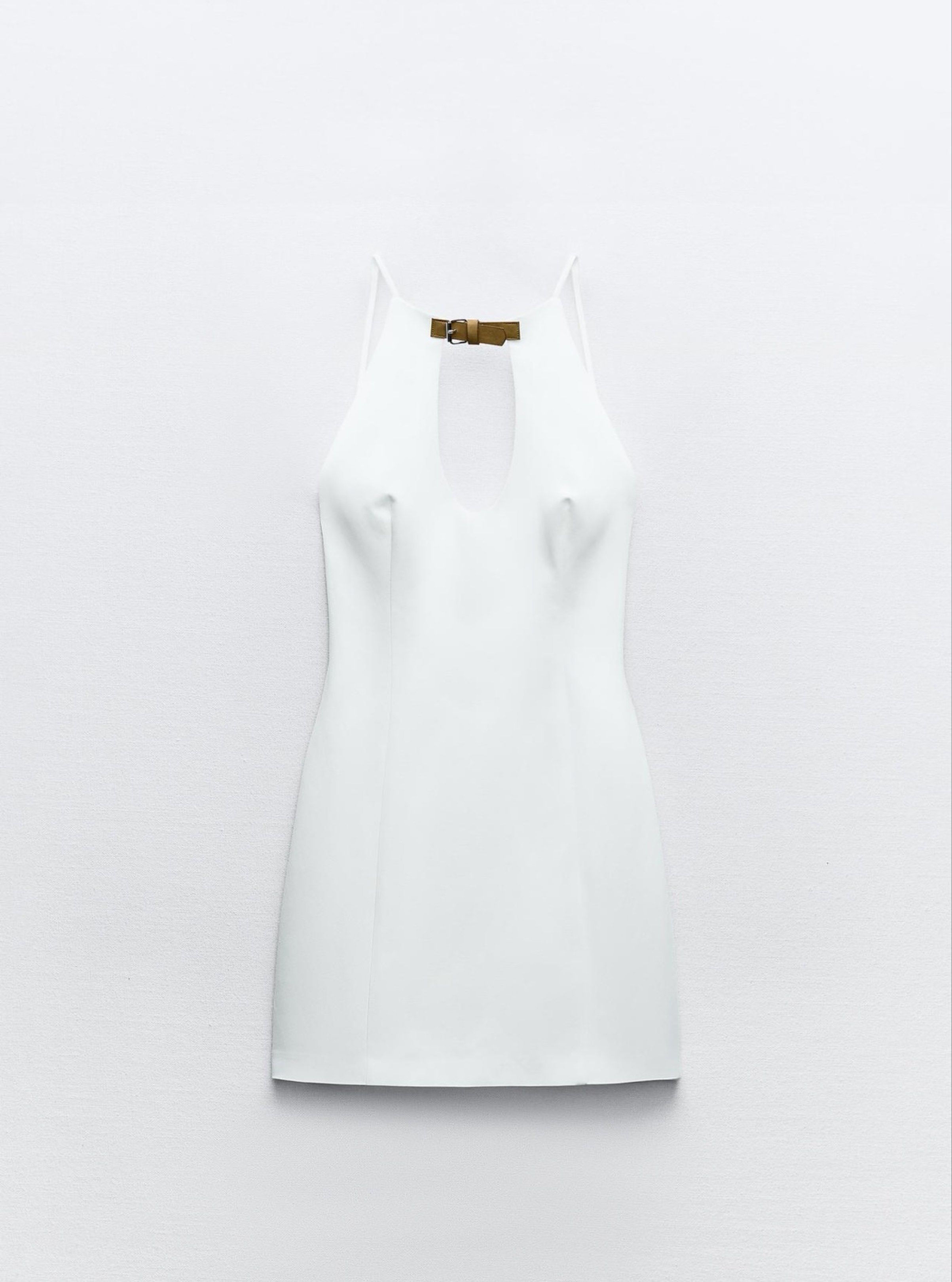 ZARA Short Halter Dress (Category: Dresses) located in Manila. Submitted by gelasprc (Listing ID 1420000204, Image 1). Description: - Zara white mini dress - Halter neckline with keyhole - Thin straps - Size XS - Fitted silhouette - Back zipper closure - Perfect for special occasions or a night out.