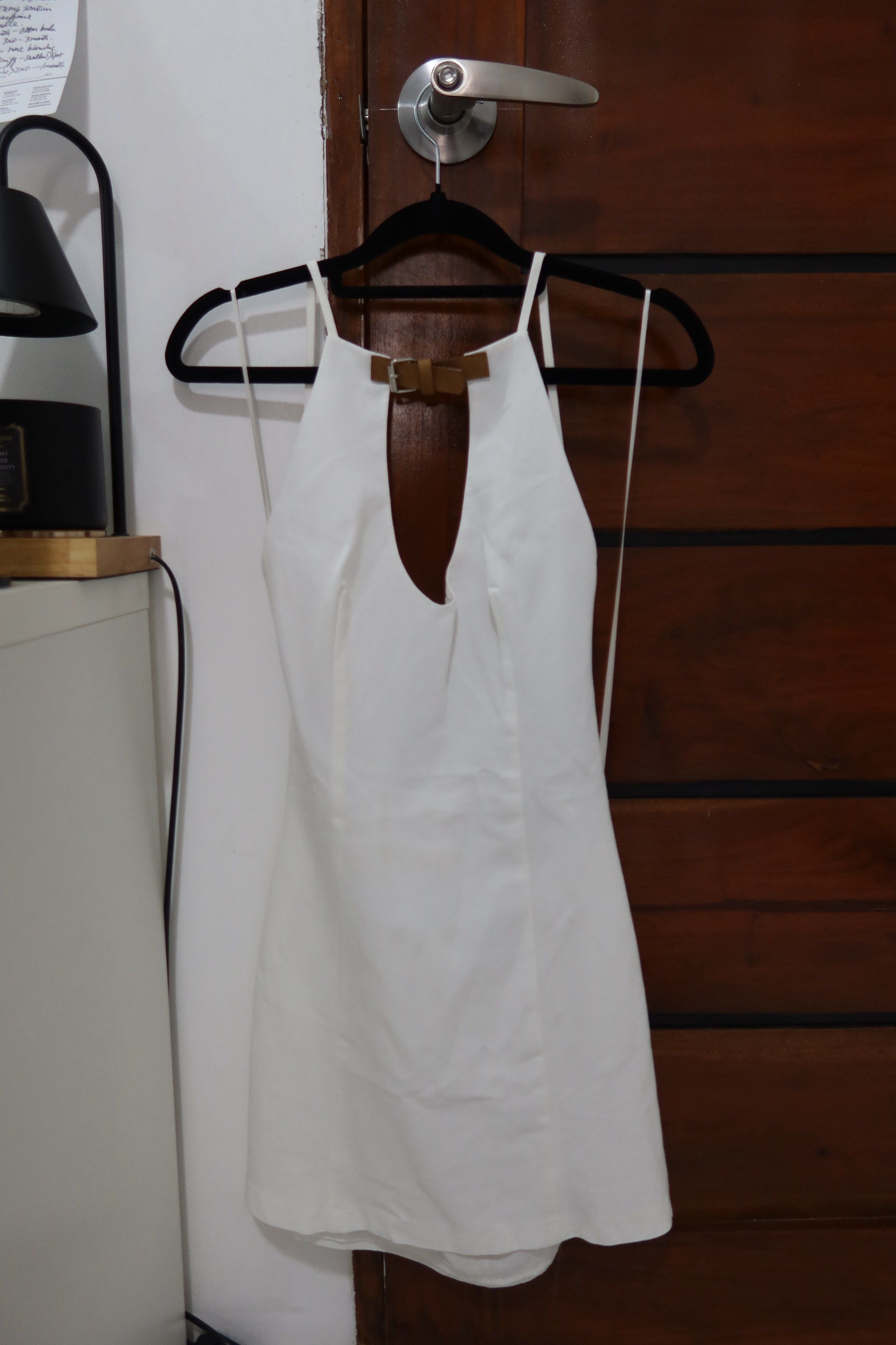 ZARA Short Halter Dress (Category: Dresses) located in Manila. Submitted by gelasprc (Listing ID 1420000204, Image 3). Description: - Zara white mini dress - Halter neckline with keyhole - Thin straps - Size XS - Fitted silhouette - Back zipper closure - Perfect for special occasions or a night out.