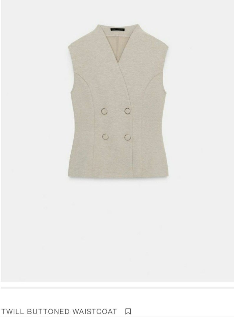 Zara Twill Buttoned Waistcoat (Category: Sleeveless) located in Tagum. Submitted by minimelstuff (Listing ID 1420093142, Image 1). Description: - Double-breasted waistcoat - Light beige color - Textured twill fabric - Tailored fit - Sleeveless - V-neck - Versatile style.