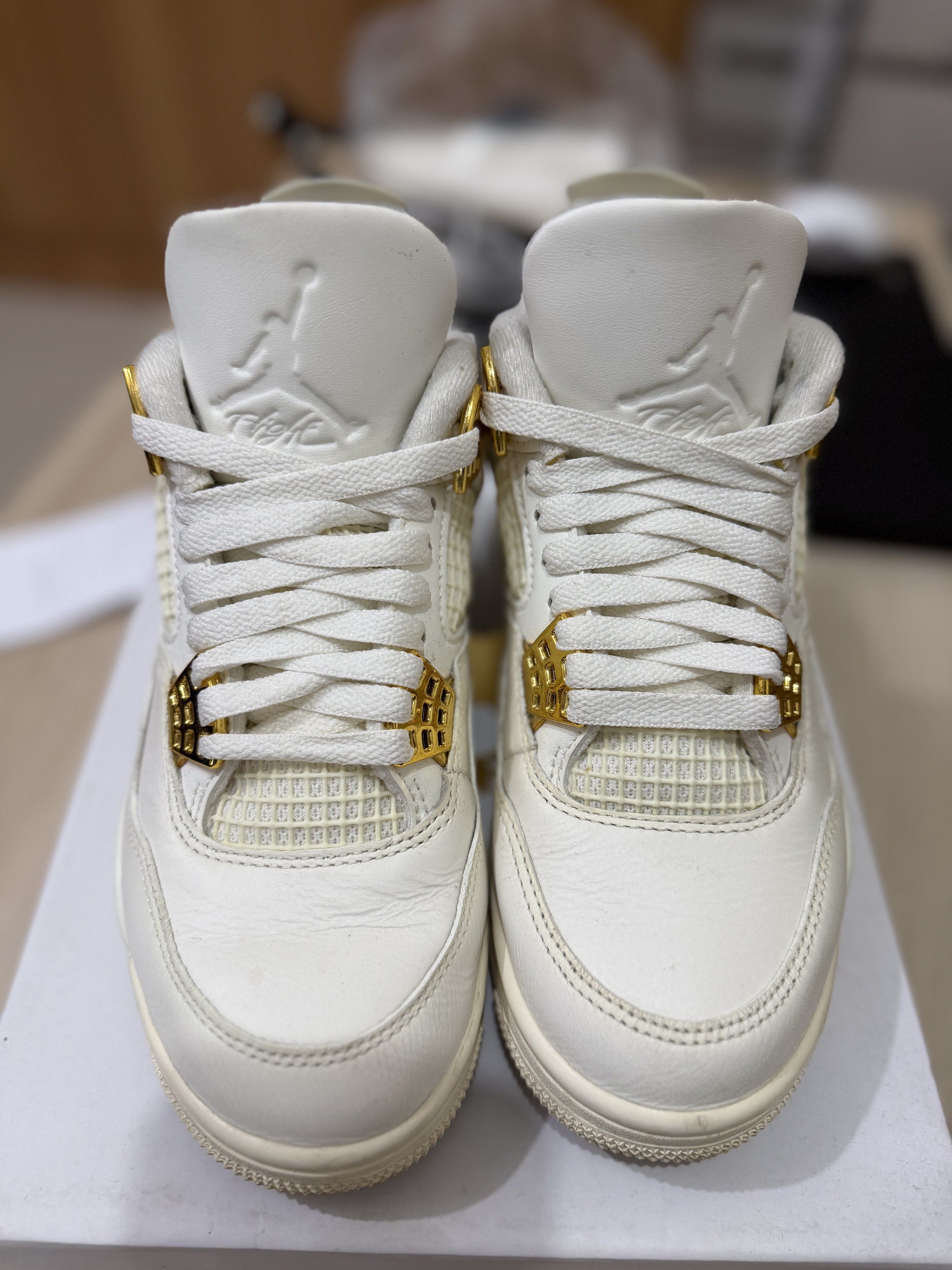 Air Jordan 4 Retro Sail Metallic Gold (Category: Sneakers) located in Taguig. Submitted by mavif (Listing ID 1420248331, Image 1). Description: - Air Jordan 4 Retro - Colorway: Sail/Metallic Gold - White leather upper with gold accents - Size: 6 US (wmns) - Includes original box.