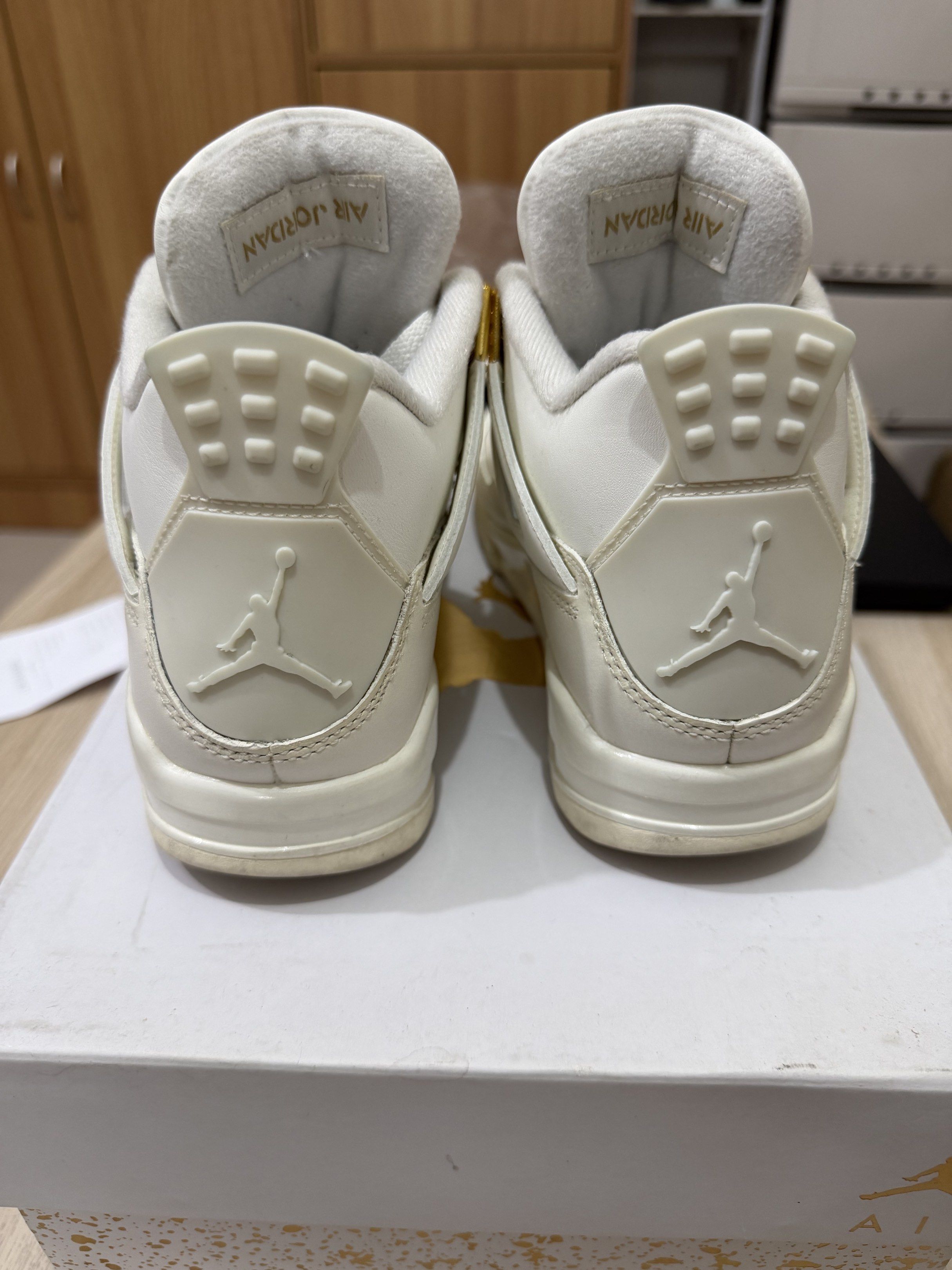 Air Jordan 4 Retro Sail Metallic Gold (Category: Sneakers) located in Taguig. Submitted by mavif (Listing ID 1420248331, Image 3). Description: - Air Jordan 4 Retro - Colorway: Sail/Metallic Gold - White leather upper with gold accents - Size: 6 US (wmns) - Includes original box.