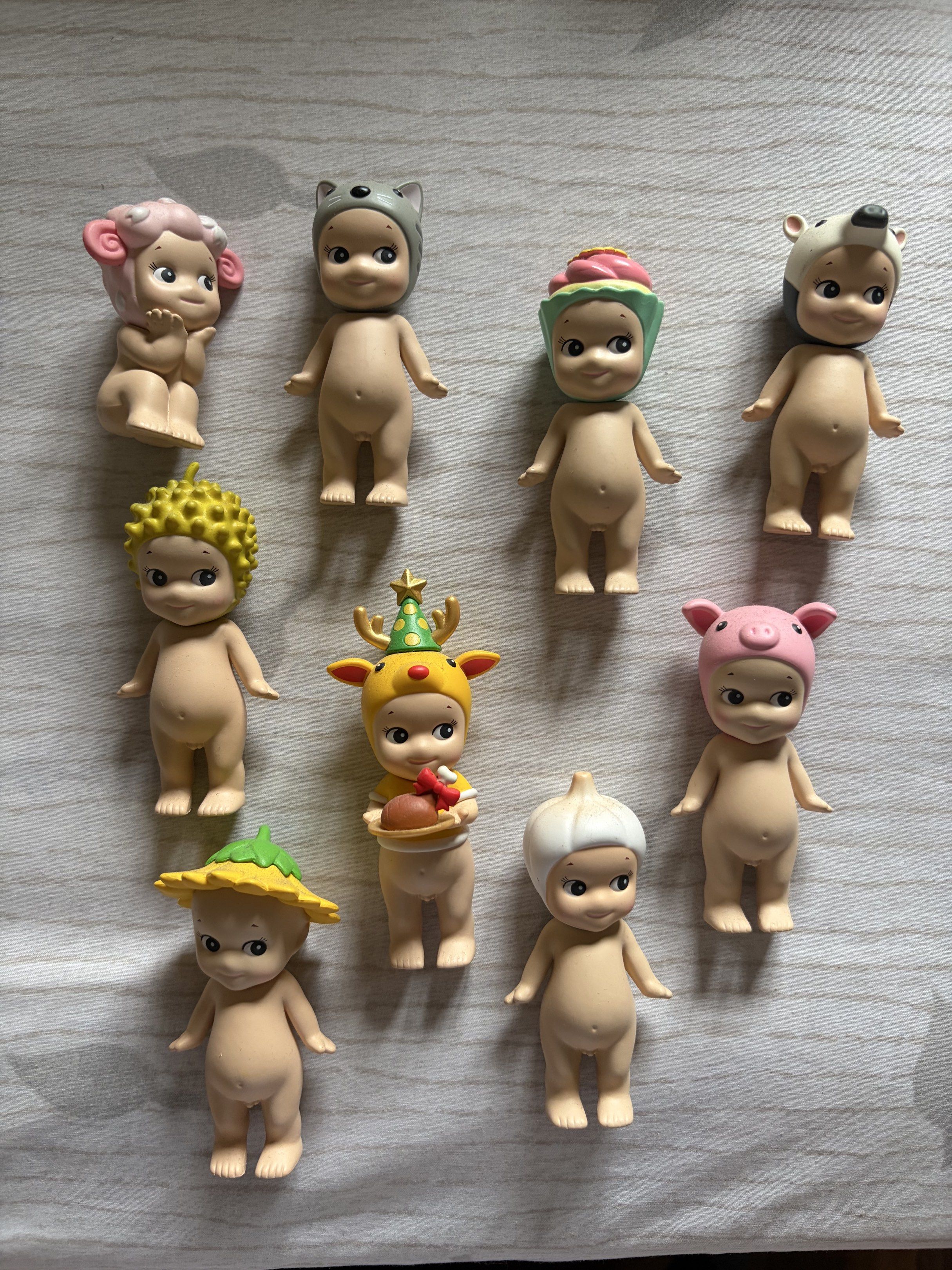 UPDATED! Assorted Sonny Angels (Category: Designer & Blind Box Toys) located in Makati City. Submitted by lenyfelix (Listing ID 1420212606, Image 1). Description: 300 each Sonny Angel figurine collection - Features adorable designs: cat, bear, hedgehog, deer, garlic, and sunflower - Each figurine has a unique hat or head covering - All figurines are in a standing position.