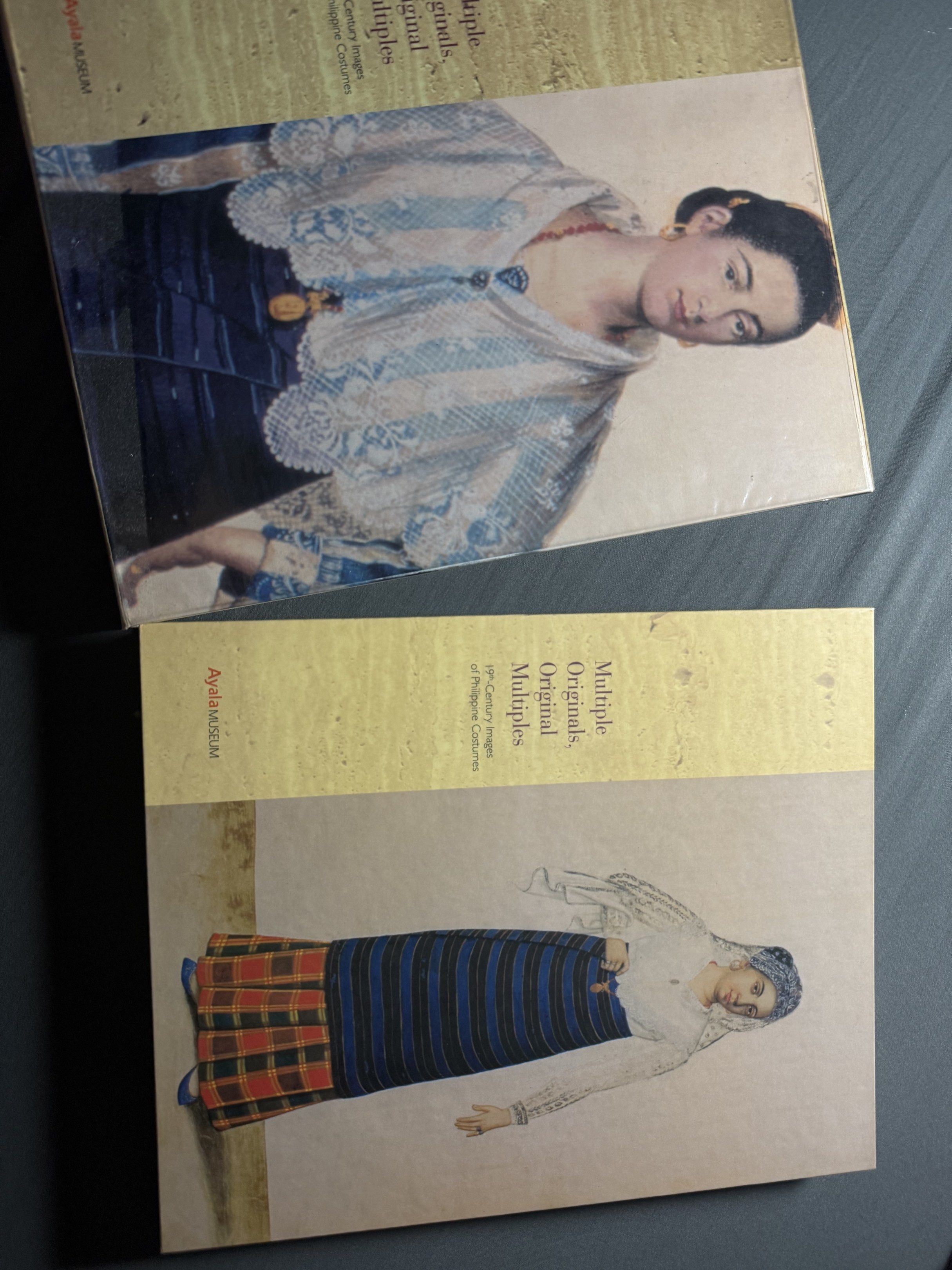 Ayala Museum Book: Multiple Originals, Original Multiples (Category: Storybooks) located in Balamban. Submitted by jvc1920 (Listing ID 1420186135, Image 2). Description: - Ayala Museum book - Features 19th-century images of Philippine costumes - Ideal for those interested in Philippine history and culture.