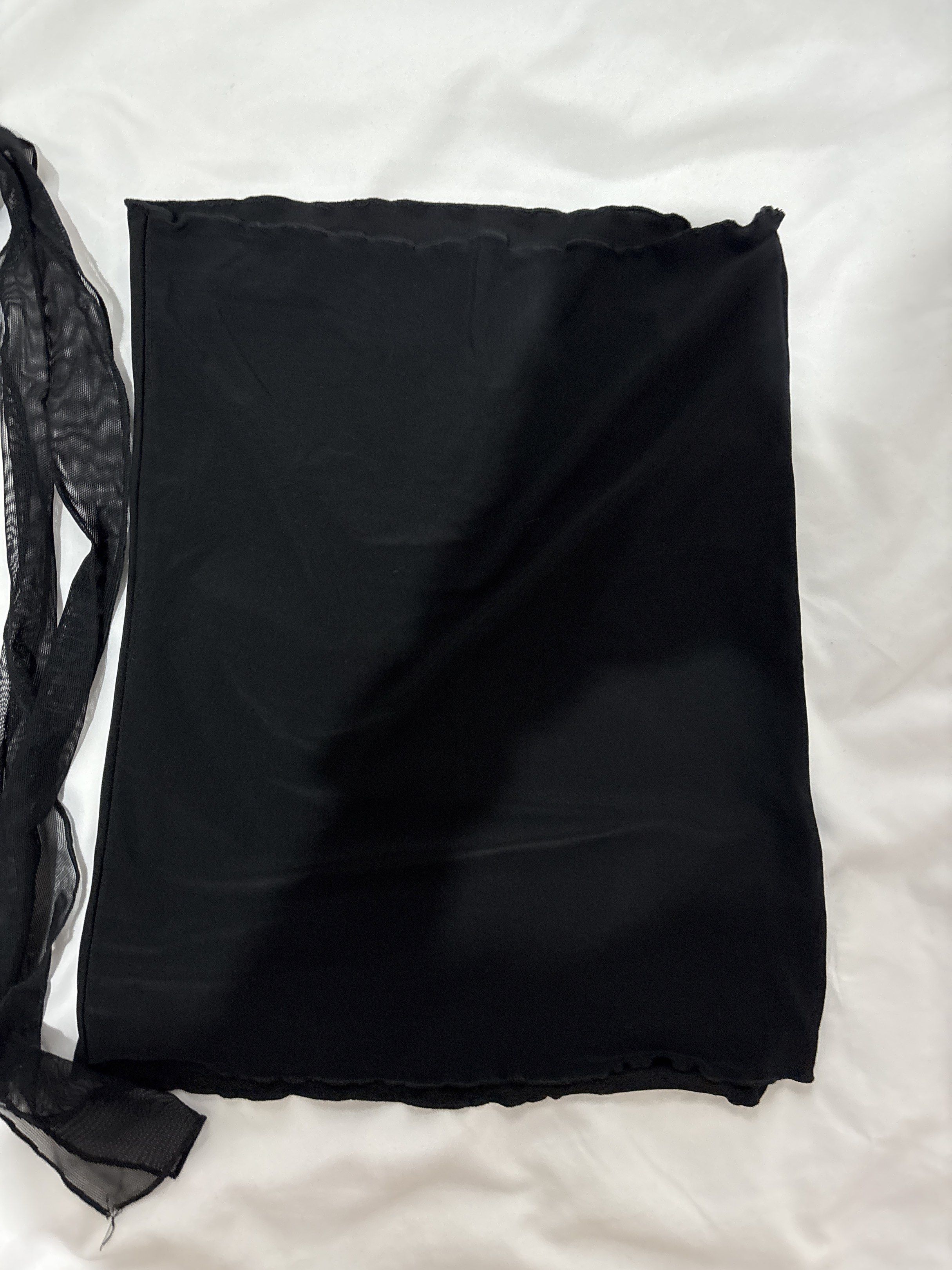 Black Mesh Tube Tie Top (Category: Dresses) located in Mandaluyong City. Submitted by castpreloveds (Listing ID 1420255659, Image 3). Description: - USED ONLY TWICE - Black mesh tie top & black tube - Ruched front detail - Flowing, sheer overlay - Sleeveless design - Includes separate tie fabric - Delicate, see-through fabric.