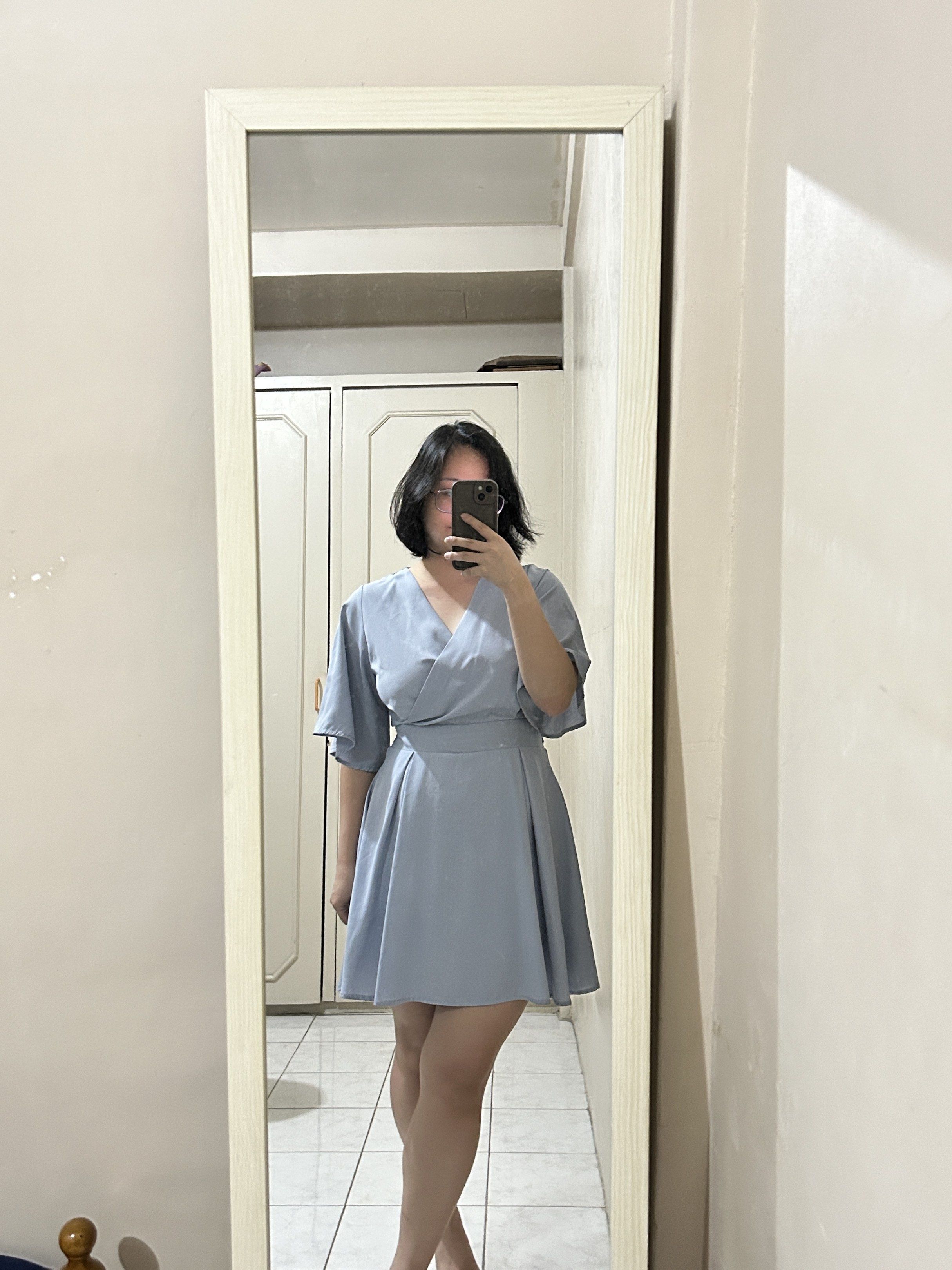 Blue Cute Dress with inner shorts (Category: Dresses) located in Bacoor. Submitted by kyespreloved (Listing ID 1420305857, Image 2). Description: Super cute dress!!! - Light blue wrap dress with Flutter sleeves - V-neckline - Tie-back detail with zipper (for the snatched waist!) - Lightweight fabric - Suitable for casual or semi-formal wear.