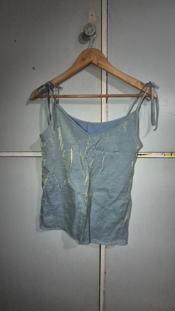 Blue Metallic Top (Category: Sleeveless) located in Manila. Submitted by declutter_s (Listing ID 1420297775, Image 1). Description: - Blue metallic sheen - Sleeveless with thin straps - Lightweight fabric - Versatile for various occasions - XS to S - Tie-on strap tops.