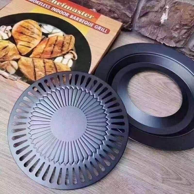 Chefmaster Smokeless Indoor Barbecue Grill 32cm (Category: Cookware & Accessories) located in Manila. Submitted by lyfrancois14 (Listing ID 1420302056, Image 2). Description: Chefmaster smokeless indoor barbecue grill is 32cm in diameter. It features a non-stick surface for easy grilling. The grill is designed for indoor use and is suitable for grilling various foods. It includes a grill plate and a surrounding ring. The box indicates it is an an