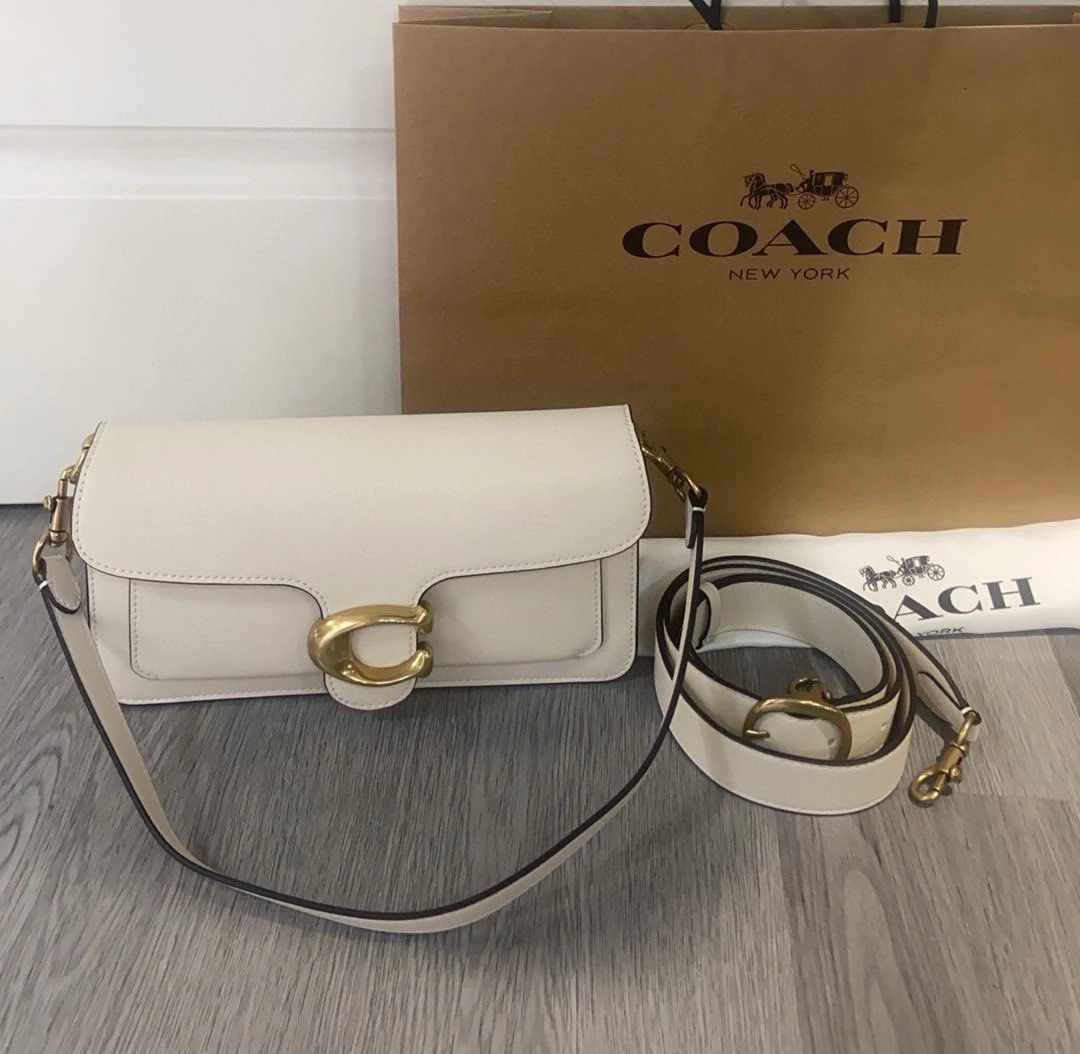 Coach Pillow Tabby Shoulder Bag (Category: Luxury Bags & Wallets) located in Manila. Submitted by randomreps (Listing ID 1420329348, Image 2). Description: - Coach Pillow Tabby shoulder bag - Sleek, rectangular design - Signature 'C' clasp - Detachable shoulder strap - Longer strap included - Comes with dust bag and Coach paper bag - Multiple interior compartments.