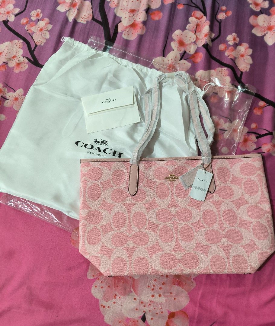 Coach Pink Tote Bag (Category: Luxury Bags & Wallets) located in Cavite. Submitted by jenniferst88424 (Listing ID 1420254571, Image 1). Description: - Coach tote bag - Pink color with Coach logo pattern - Includes dust bag, tags, and care card - Magnetic closure - Multiple interior pockets - Light pink interior - brand new.