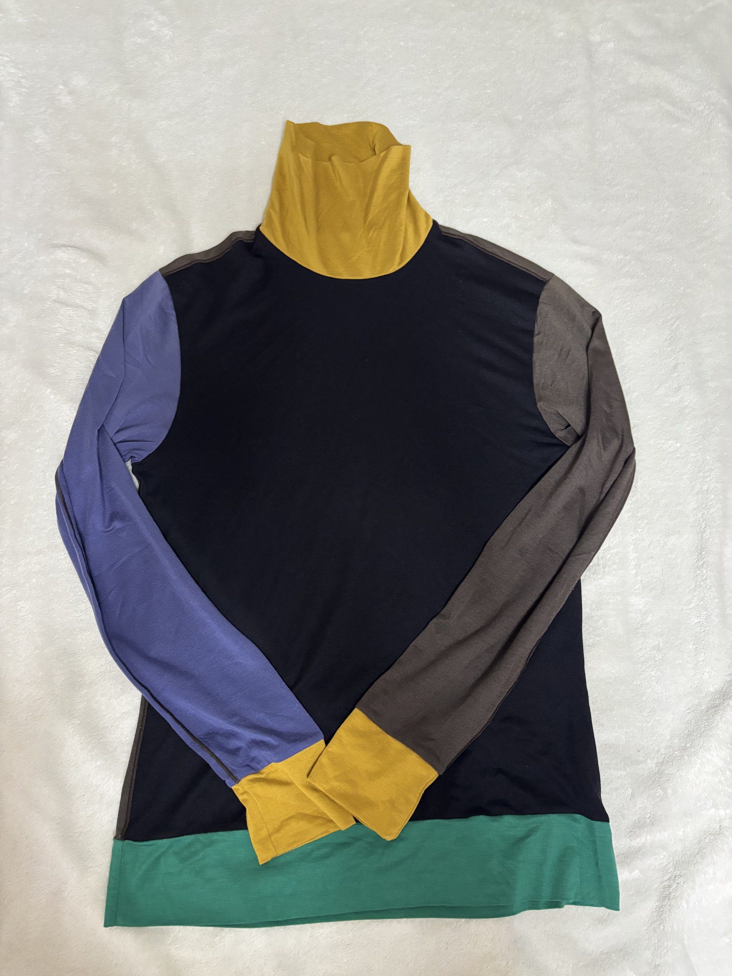 Colorblock Turtleneck heattech Long Sleeve Top (Category: Longsleeves) located in Iloilo. Submitted by kinyyyyy (Listing ID 1420303942, Image 1). Description: - Colorblock design - Navy blue body - Mustard yellow turtleneck and cuffs - Purple and brown sleeves - Green bottom hem - Long-sleeved - Stylish and eye-catching.