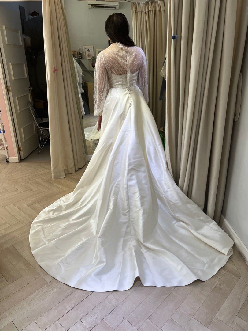 Elegant White Wedding Gown with Train (Category: Evening dresses & gowns) located in Taguig. Submitted by prvyr (Listing ID 1420246888, Image 3). Description: - Beautiful white wedding gown - Flowing skirt and long train - Fitted bodice with spaghetti straps - V-neckline - Classic, timeless design - Unique, sheer embellished back Will not include add on transparent sleeves Can include veil.