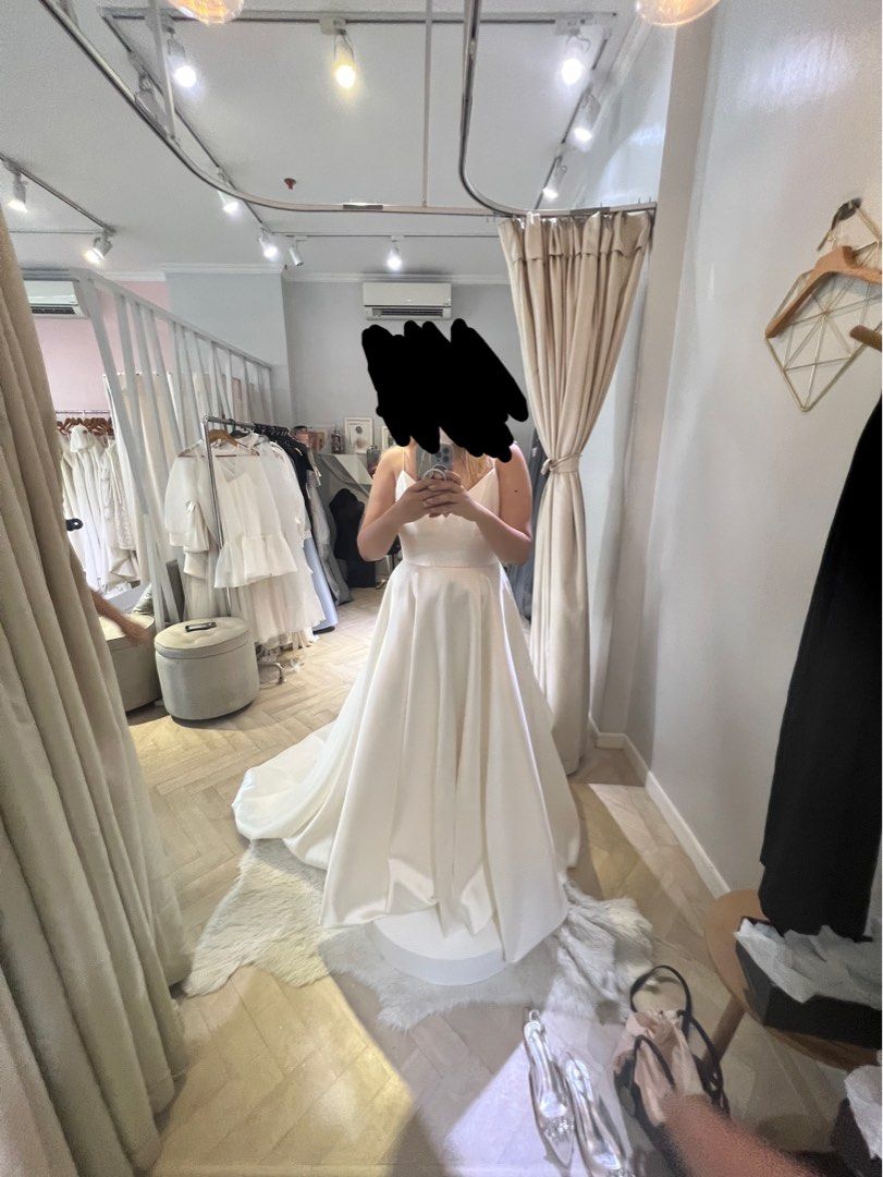 Elegant White Wedding Gown with Train (Category: Evening dresses & gowns) located in Taguig. Submitted by prvyr (Listing ID 1420246888, Image 2). Description: - Beautiful white wedding gown - Flowing skirt and long train - Fitted bodice with spaghetti straps - V-neckline - Classic, timeless design - Unique, sheer embellished back Will not include add on transparent sleeves Can include veil.