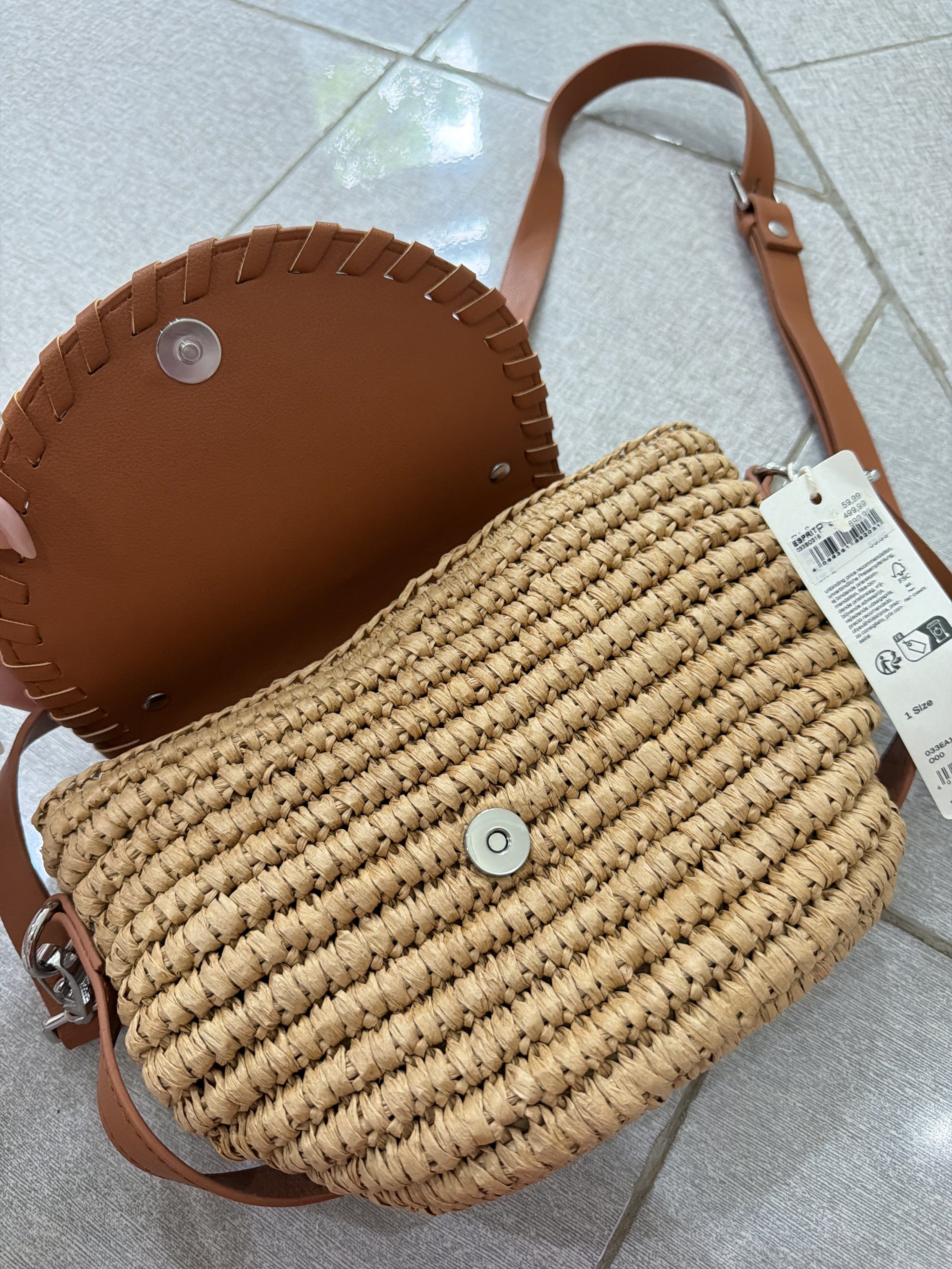 Esprit Woven Crossbody Bag Beach Bag (Category: Cross-body Bags) located in Makati City. Submitted by thrift_angel (Listing ID 1420184167, Image 3). Description: - Brand: espirit - Crossbody bag - Material: Woven straw body with brown leather flap - Closure: Magnetic - Strap: Adjustable - Interior: Lined - Condition: New with tag.