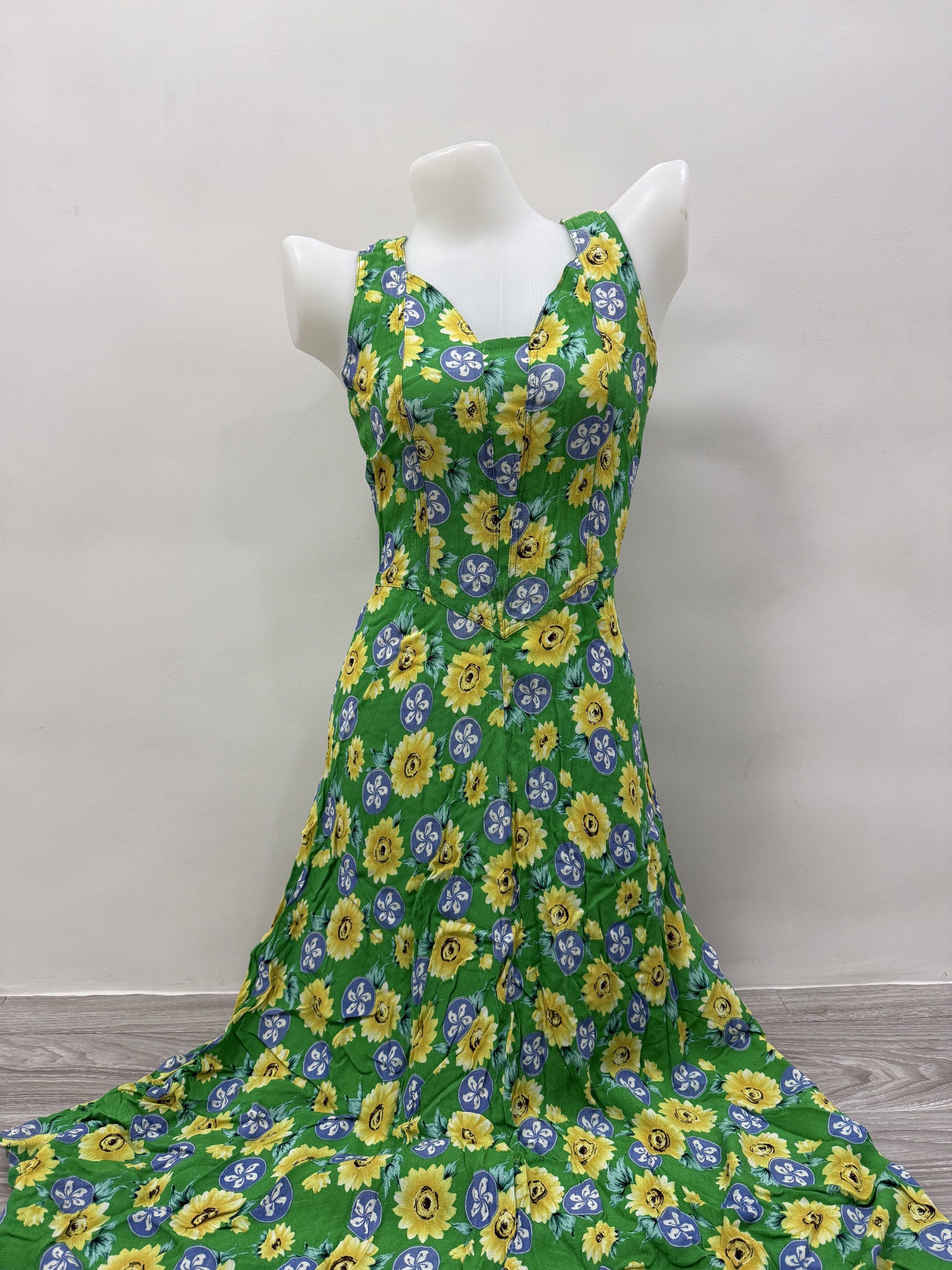 Floral Print Maxi Dress (Category: Dresses) located in Taguig. Submitted by gelpingol (Listing ID 1420215012, Image 1). Description: - Green maxi dress with a cheerful sunflower print. - Sleeveless design with a flattering V-neckline. - Features a flowing, lightweight skirt. - Made from a breathable fabric, ideal for warm weather. - Fitted bodice for a flattering silhouette. - Perfect for casual outings and summer events..
