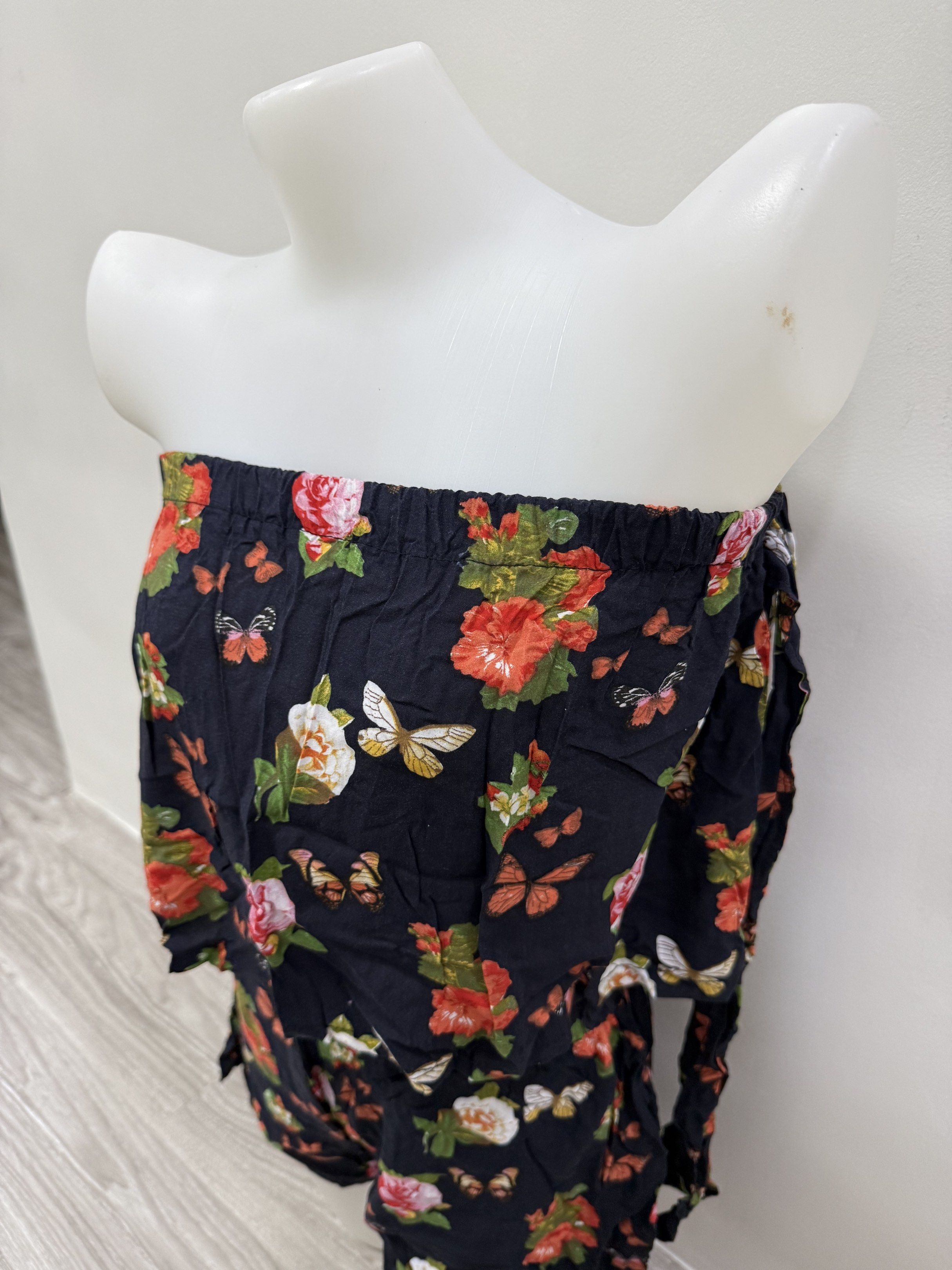 Floral Print Off-Shoulder Co-ord Set (Category: Sets or Coordinates) located in Taguig. Submitted by gelpingol (Listing ID 1420233734, Image 3). Description: - Floral and butterfly print co-ord set - Includes an off-shoulder top with tie details on the sleeves - Shorts feature an elastic waistband - Made of lightweight fabric - Ideal for warm weather.