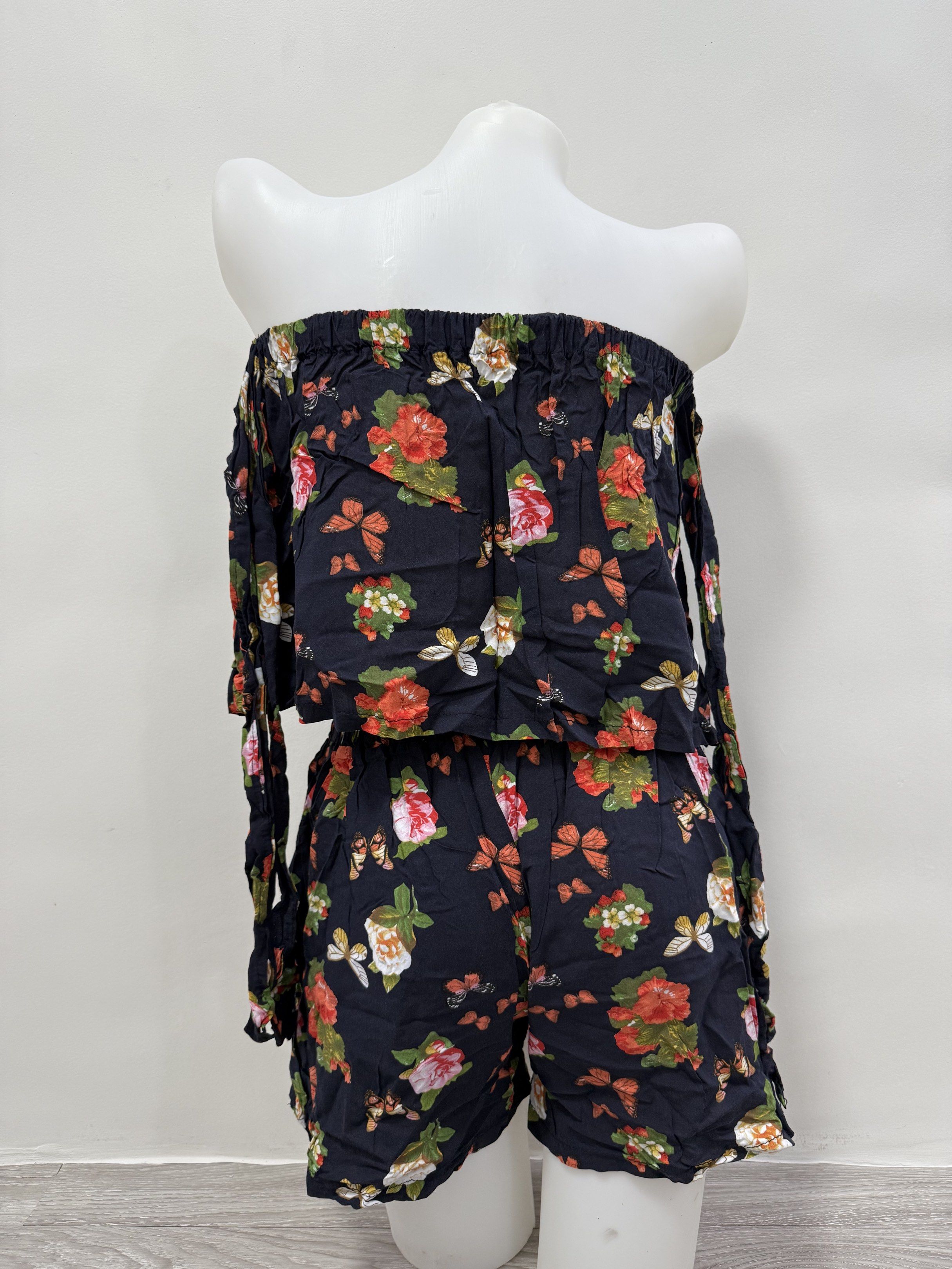 Floral Print Off-Shoulder Co-ord Set (Category: Sets or Coordinates) located in Taguig. Submitted by gelpingol (Listing ID 1420233734, Image 2). Description: - Floral and butterfly print co-ord set - Includes an off-shoulder top with tie details on the sleeves - Shorts feature an elastic waistband - Made of lightweight fabric - Ideal for warm weather.