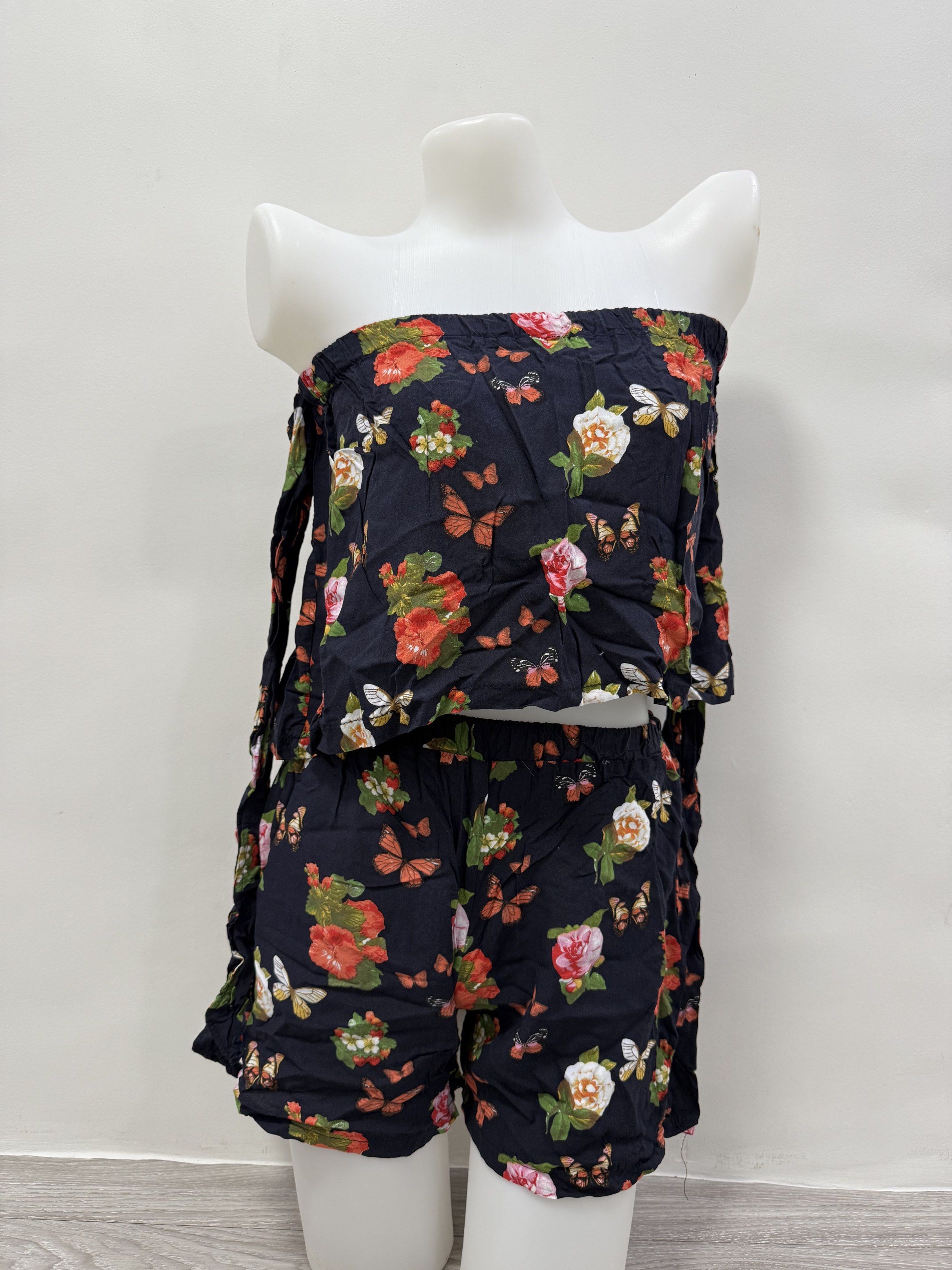 Floral Print Off-Shoulder Co-ord Set (Category: Sets or Coordinates) located in Taguig. Submitted by gelpingol (Listing ID 1420233734, Image 1). Description: - Floral and butterfly print co-ord set - Includes an off-shoulder top with tie details on the sleeves - Shorts feature an elastic waistband - Made of lightweight fabric - Ideal for warm weather.