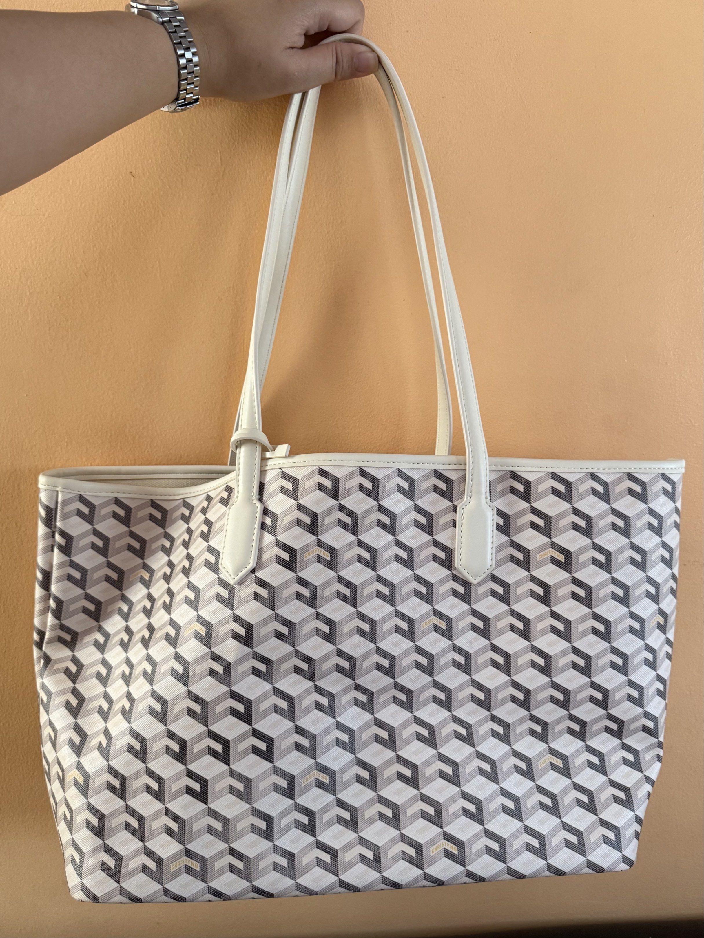 Geometric Pattern Tote Bag with Wallet (Category: Luxury Bags & Wallets) located in Malolos. Submitted by prelovedbydrjen (Listing ID 1420213005, Image 2). Description: - Tote bag with geometric design - Matching wallet included - Cream-colored handles and trim - Light cream interior - Wallet features similar geometric pattern - Ideal for daily use - Used once.