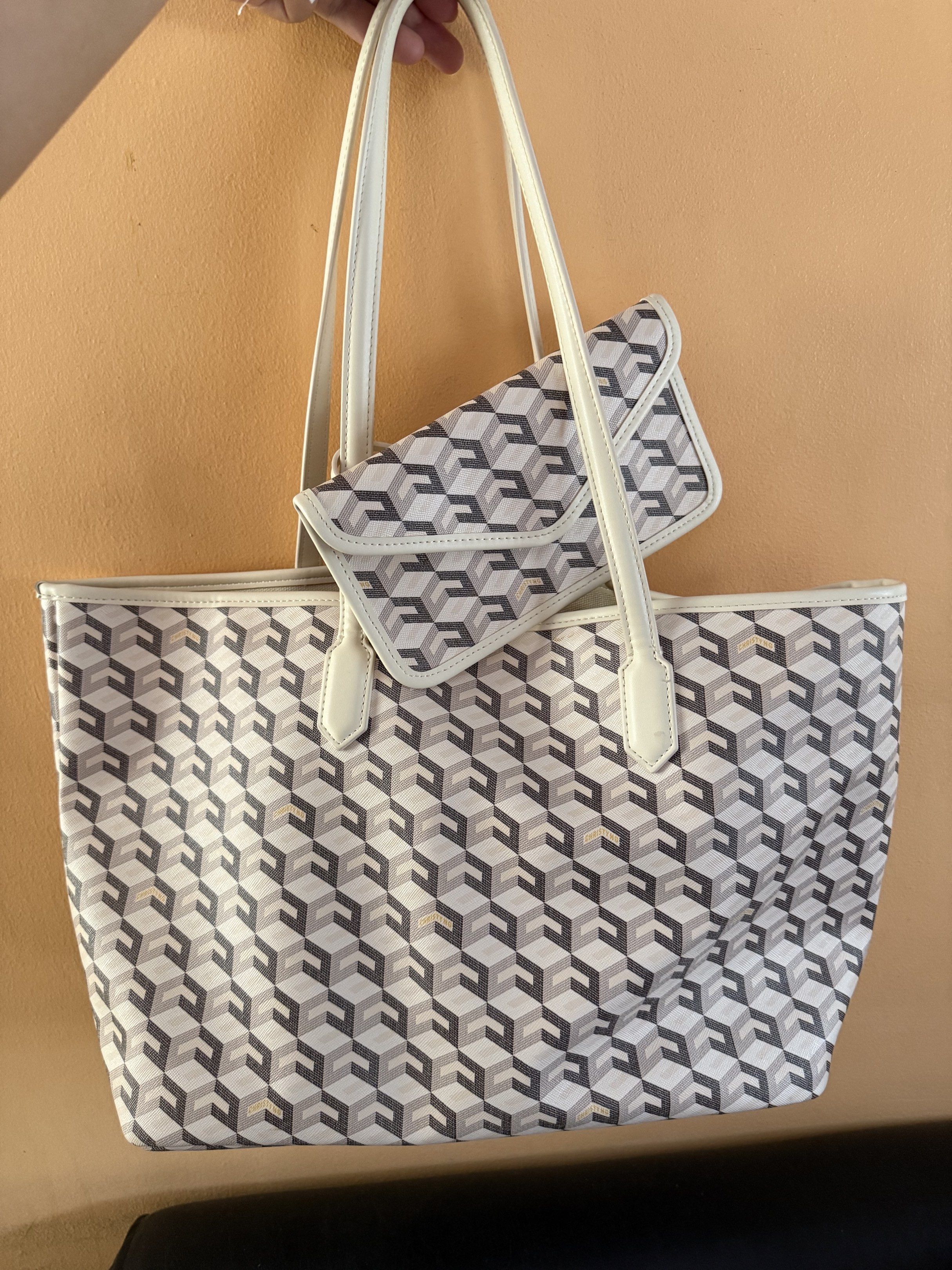Geometric Pattern Tote Bag with Wallet (Category: Luxury Bags & Wallets) located in Malolos. Submitted by prelovedbydrjen (Listing ID 1420213005, Image 1). Description: - Tote bag with geometric design - Matching wallet included - Cream-colored handles and trim - Light cream interior - Wallet features similar geometric pattern - Ideal for daily use - Used once.