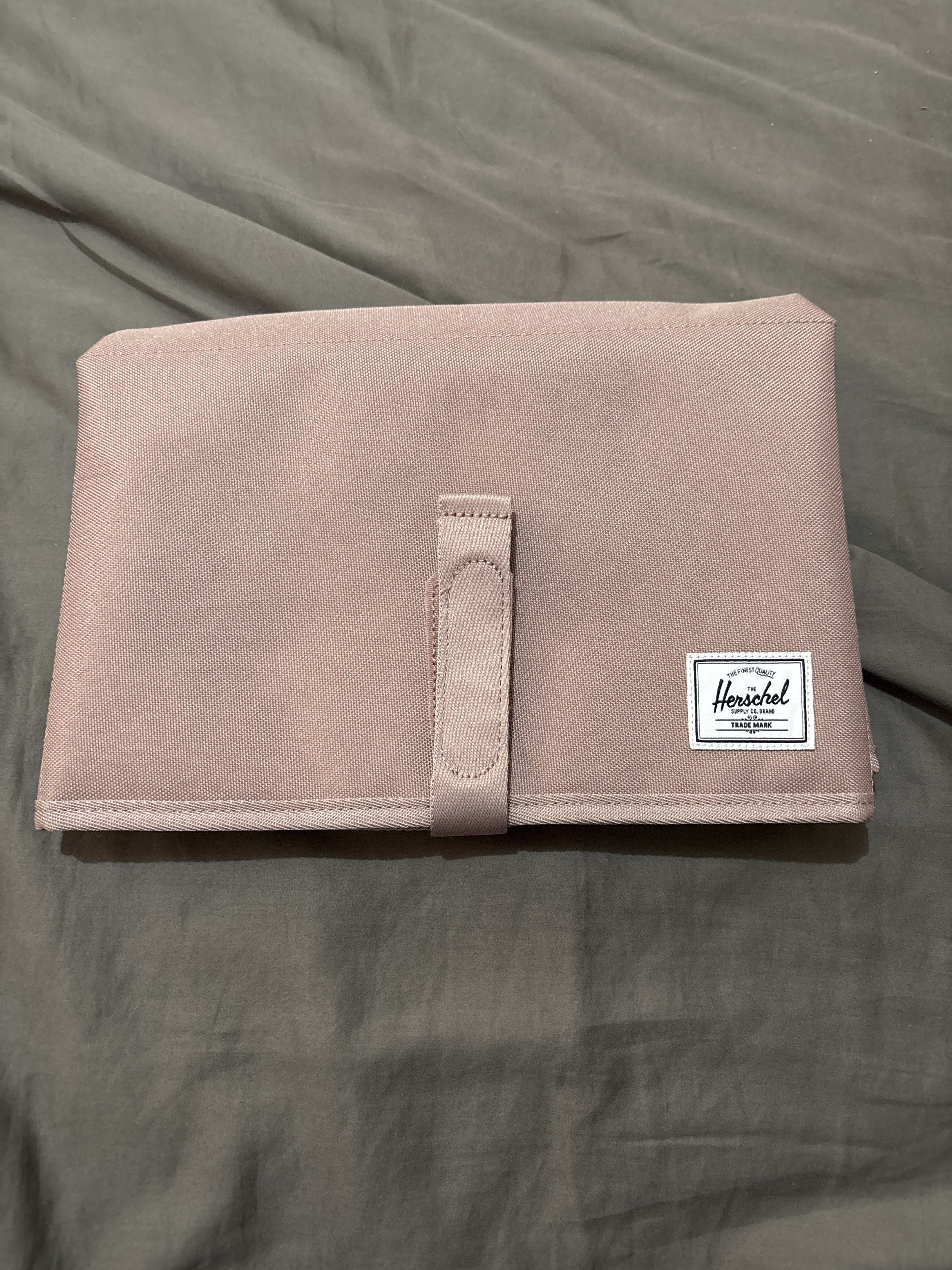 Herschel Changing Mat (Category: Changing Mats & Accessories) located in Quezon City. Submitted by msuyo (Listing ID 1420231509, Image 3). Description: -Design: Foldable, padded mat with a reinforced, easy-wipe liner. RFS: migrating SF to be shouldered by buyer Lalamove/ grab/ etc. 📍QC.