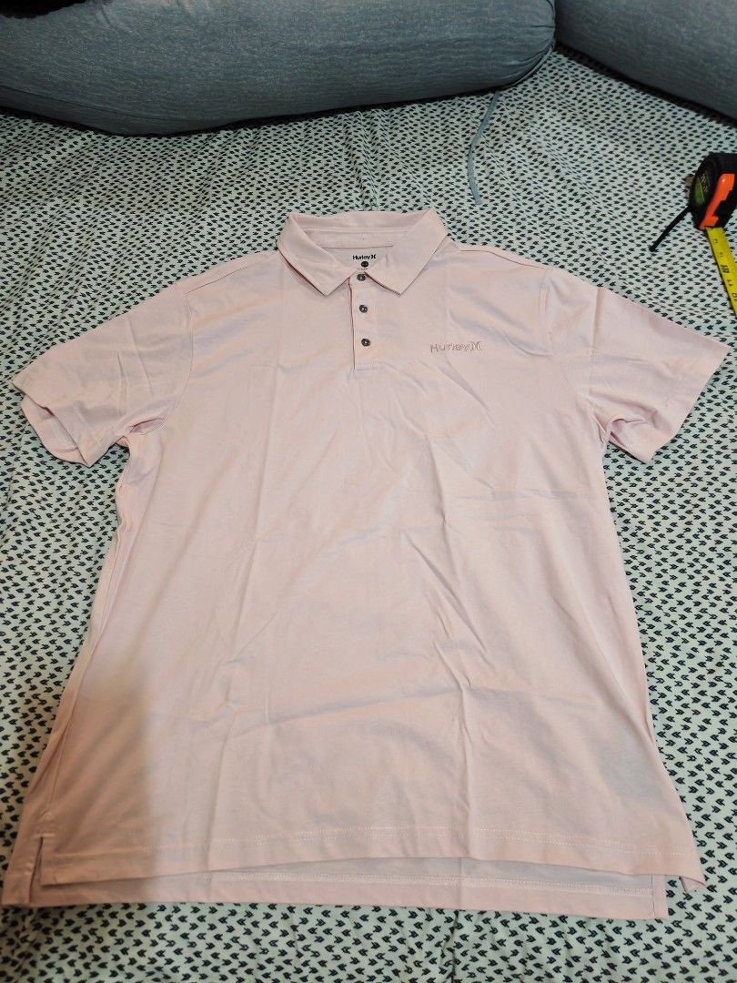 Hurley Polo Shirt - XL (Category: Tshirts & Polo Shirts ) located in Caloocan City. Submitted by thanntrums (Listing ID 1420159183, Image 1). Description: - Pink Hurley polo shirt - Size: XL - Features a three-button placket - Hurley logo on the chest - Made in India.