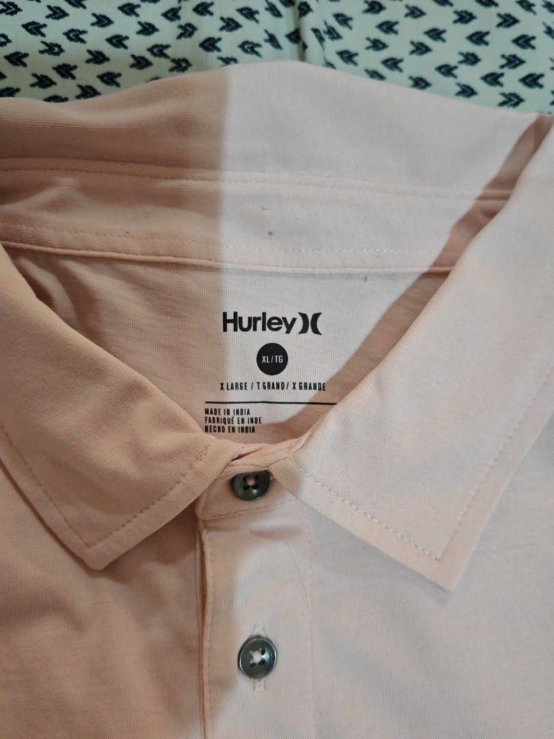 Hurley Polo Shirt - XL (Category: Tshirts & Polo Shirts ) located in Caloocan City. Submitted by thanntrums (Listing ID 1420159183, Image 3). Description: - Pink Hurley polo shirt - Size: XL - Features a three-button placket - Hurley logo on the chest - Made in India.