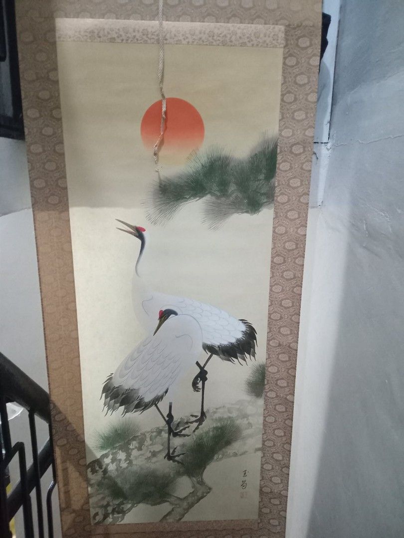 Japanese Crane Scroll Painting (Category: Wall Decor) located in Taguig. Submitted by ashicollection (Listing ID 1420347164, Image 2). Description: - Japanese scroll painting - Features two cranes and a red sun - Elegant cream-colored background - Decorative border - Includes ribbons for hanging.