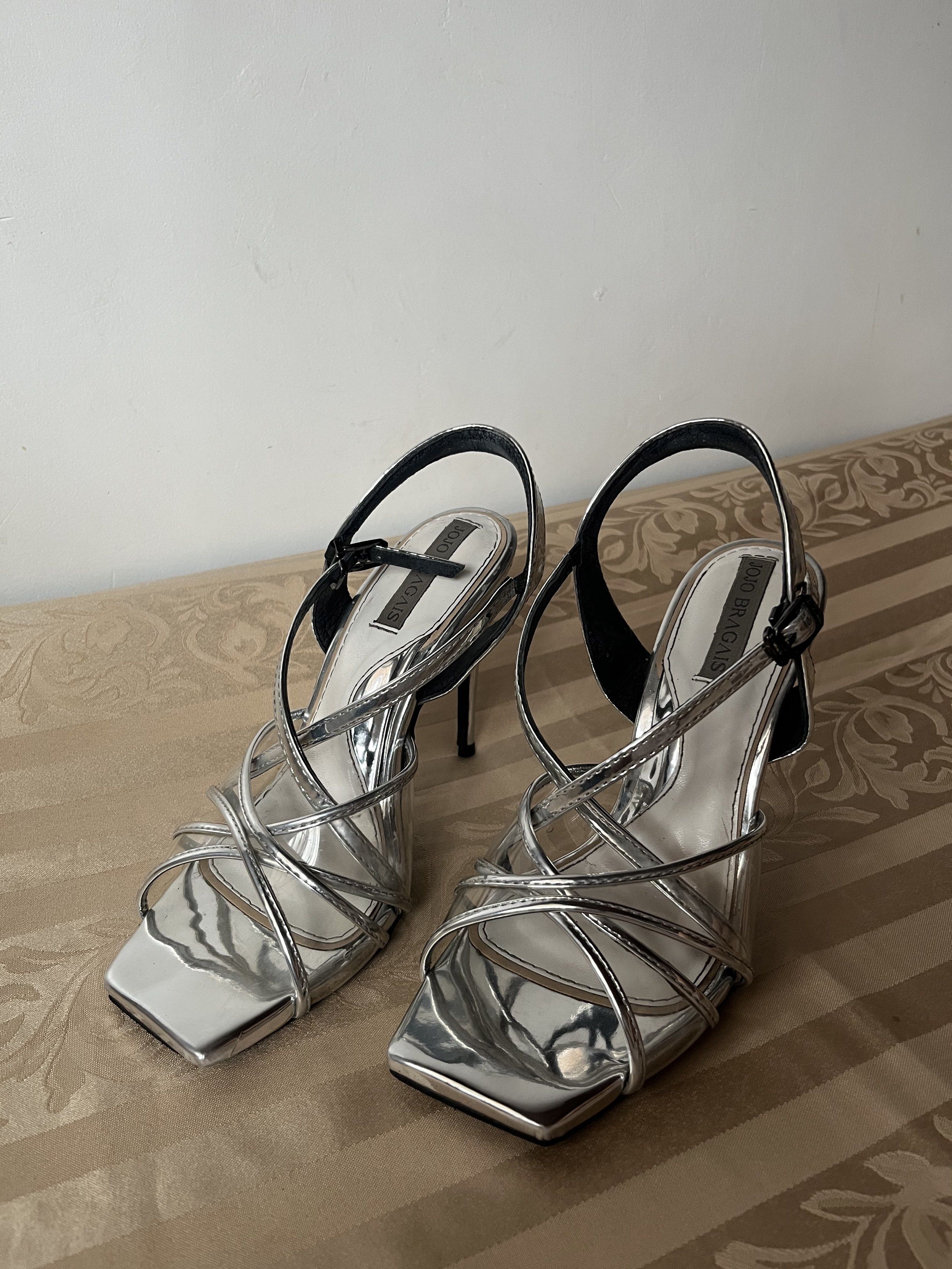 Jojo Bragais MMD Silver Heels Pageant Heels (Category: Heels) located in Santa Ana. Submitted by PAMPANGA.LOCATION (Listing ID 1420159241, Image 1). Description: - Silver strappy design - Stiletto heel 4 inches - Adjustable ankle strap - Metallic finish and very luxurious - Perfect for special occasions/pageants -Barbie feels! with box and dust bag size 41 worn few times only ((my own feet size is 39.5, the heels fit good to me because the straps