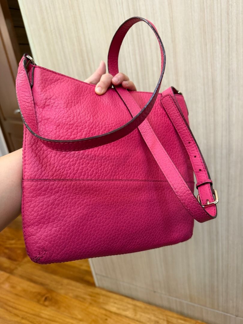 Kate Spade Pink Leather Crossbody Bag (Category: Cross-body Bags) located in Manila. Submitted by mts7890 (Listing ID 1420164550, Image 3). Description: - Kate Spade crossbody bag - Vibrant pink color - Textured leather exterior - Adjustable long strap - Zip closure - Small logo detail - Compact size - Simple and elegant design.