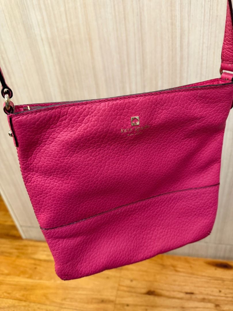 Kate Spade Pink Leather Crossbody Bag (Category: Cross-body Bags) located in Manila. Submitted by mts7890 (Listing ID 1420164550, Image 1). Description: - Kate Spade crossbody bag - Vibrant pink color - Textured leather exterior - Adjustable long strap - Zip closure - Small logo detail - Compact size - Simple and elegant design.