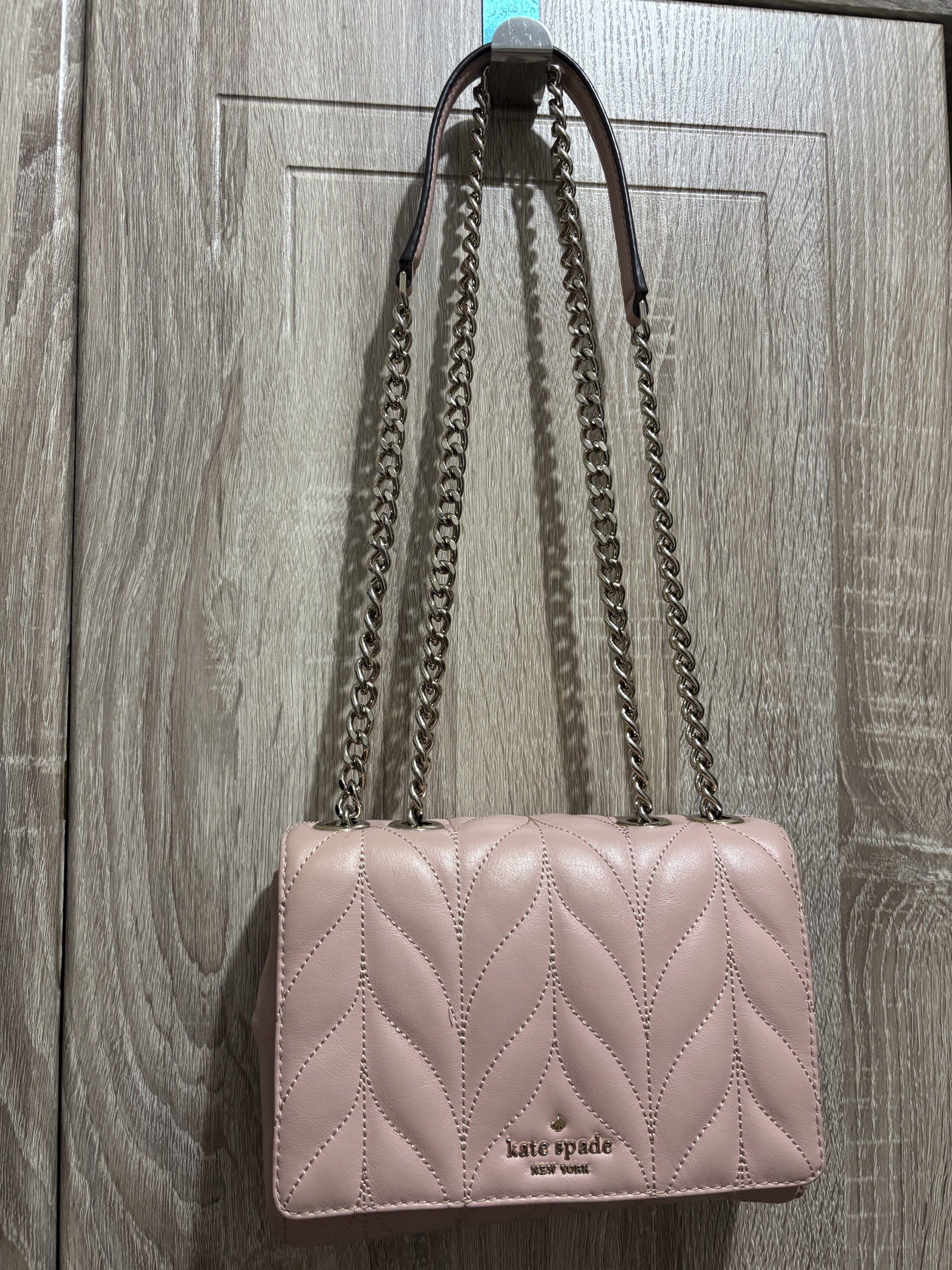 Kate Spade Pink Quilted Shoulder Bag (Category: Luxury Bags & Wallets) located in Cavite. Submitted by thewatchph (Listing ID 1420311186, Image 1). Description: KATE SPADE - Authentic Kate Spade shoulder bag - Chic quilted design - Elegant chain strap - Pretty pink color - Secure flap closure - Interior small pocket - Iconic Kate Spade logo - Includes care card -in good condition (used but not abused) RFS: declutering.