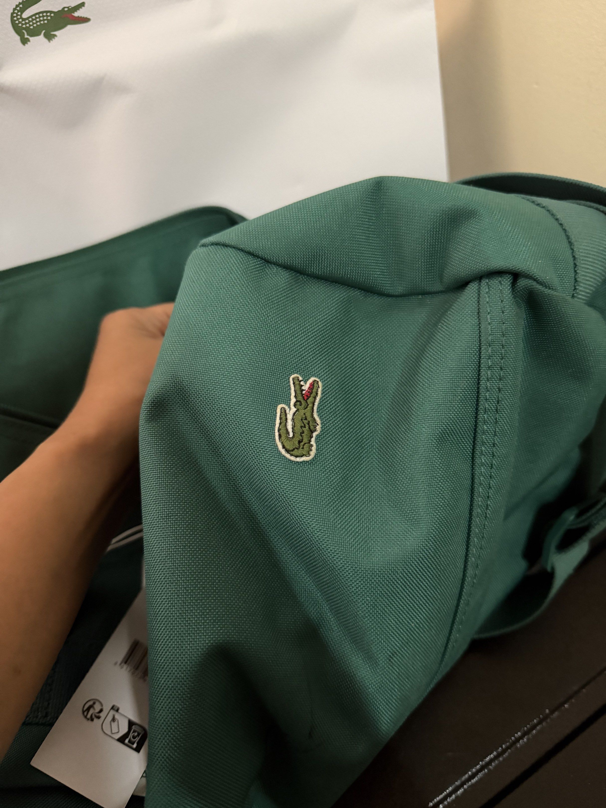 Lacoste Green Duffle Bag/ Gym Bag (Category: Sling Bags) located in Caloocan City. Submitted by bbkk08 (Listing ID 1420224040, Image 2). Description: - Authentic Lacoste duffle bag - Vibrant green color - Features the iconic Lacoste logo - Includes original tags - Comes with a Lacoste shopping bag - Spacious design - Suitable for travel or everyday use - Sturdy handles - Classic design -new model .
