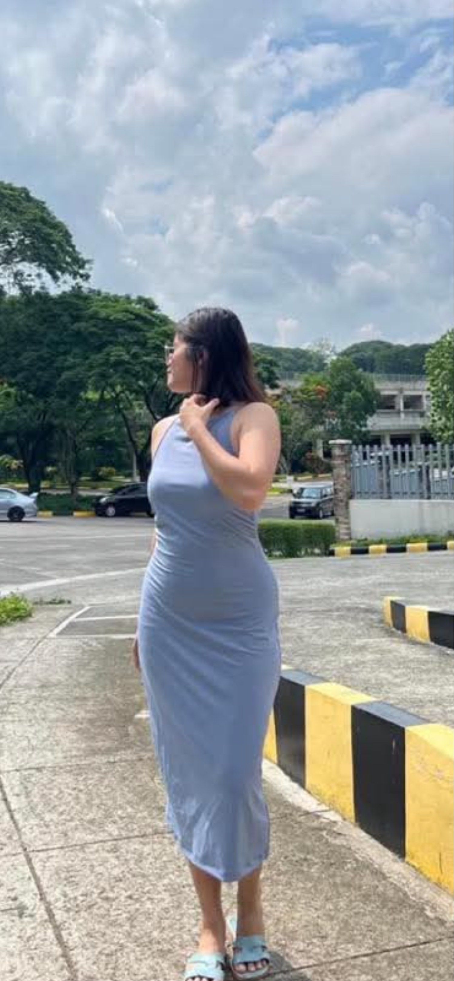 Light Blue Sleeveless Midi Dress (Category: Dresses) located in Bulacan. Submitted by kkaye_ (Listing ID 1420262076, Image 2). Description: - Light blue midi dress - Sleeveless halter neck - Form-fitting silhouette - Mid-calf length - Smooth, likely stretchy fabric - Versatile for casual wear.