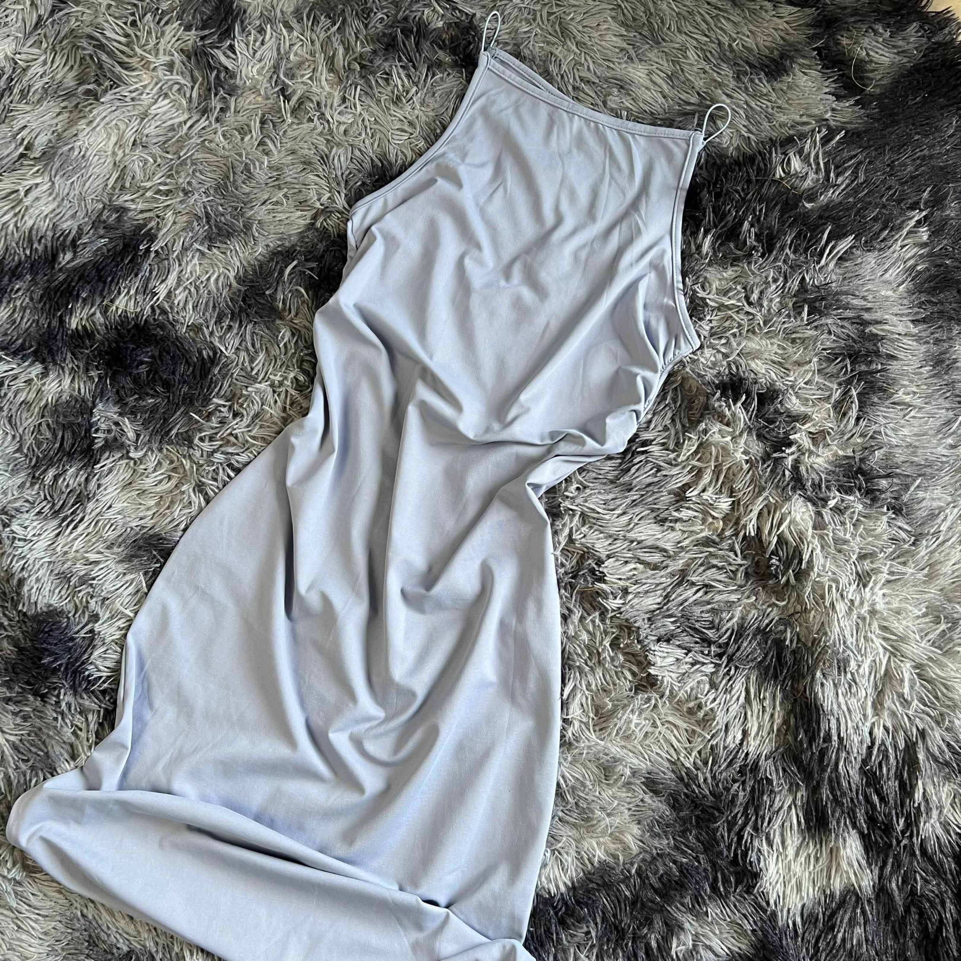 Light Blue Sleeveless Midi Dress (Category: Dresses) located in Bulacan. Submitted by kkaye_ (Listing ID 1420262076, Image 1). Description: - Light blue midi dress - Sleeveless halter neck - Form-fitting silhouette - Mid-calf length - Smooth, likely stretchy fabric - Versatile for casual wear.