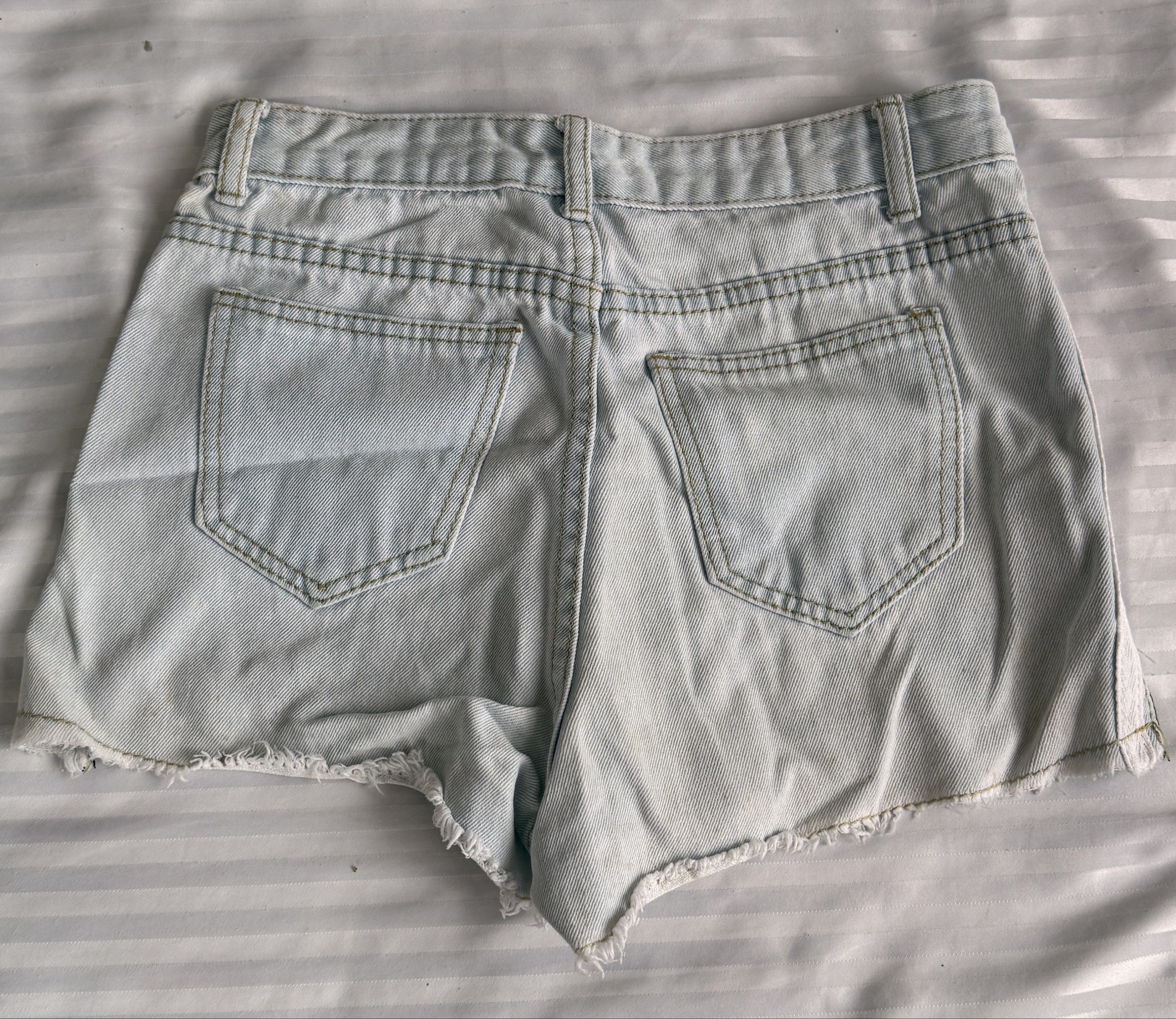 Light Wash Denim Shorts with Side Stripes (Category: Shorts) located in Lucban. Submitted by milesj. (Listing ID 1420175859, Image 2). Description: - Light wash denim shorts - Distressed details and raw hem - White side stripes - Classic five-pocket design - Button and zipper closure - Two back pockets and two front pockets - Perfect for casual wear.