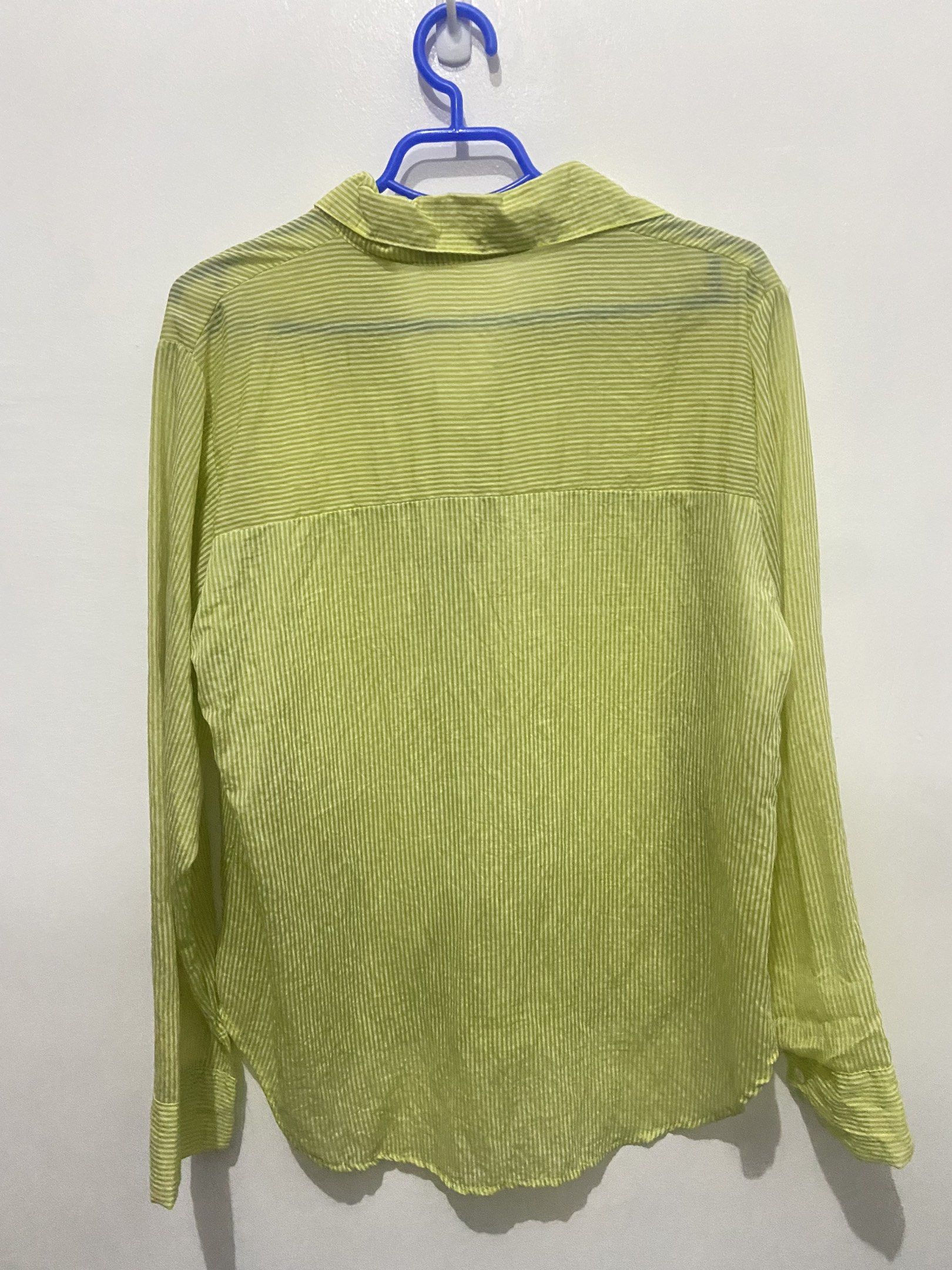 Lime Green Striped Shirt (Category: Shirts) located in Pasay City. Submitted by trixietrix (Listing ID 1420273567, Image 2). Description: - Vibrant lime green color - Subtle vertical stripes - Classic collared neckline - Long sleeves - Button-down front - Lightweight, sheer fabric, lightly see through - Worn once on a beach trip.