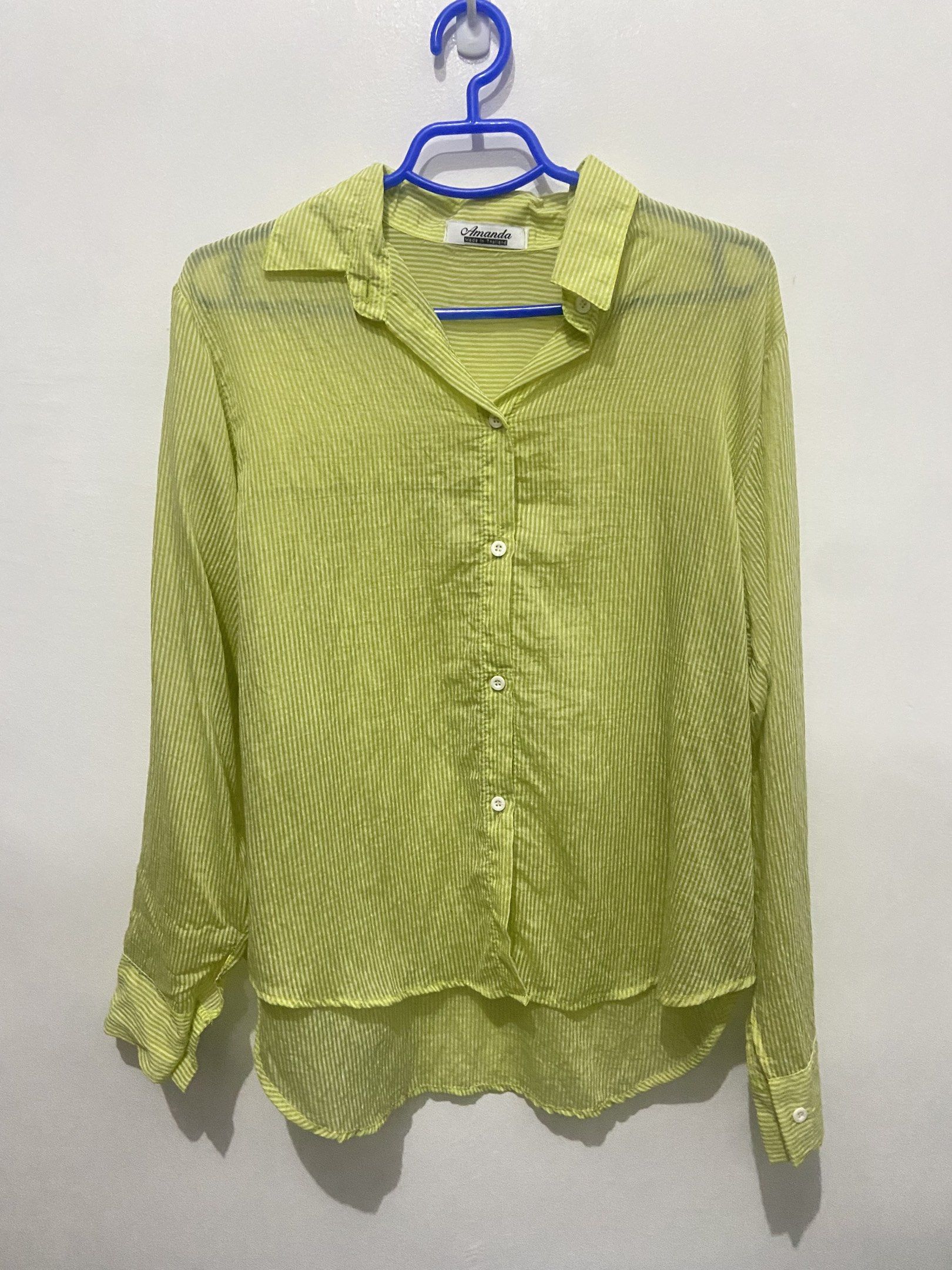Lime Green Striped Shirt (Category: Shirts) located in Pasay City. Submitted by trixietrix (Listing ID 1420273567, Image 1). Description: - Vibrant lime green color - Subtle vertical stripes - Classic collared neckline - Long sleeves - Button-down front - Lightweight, sheer fabric, lightly see through - Worn once on a beach trip.