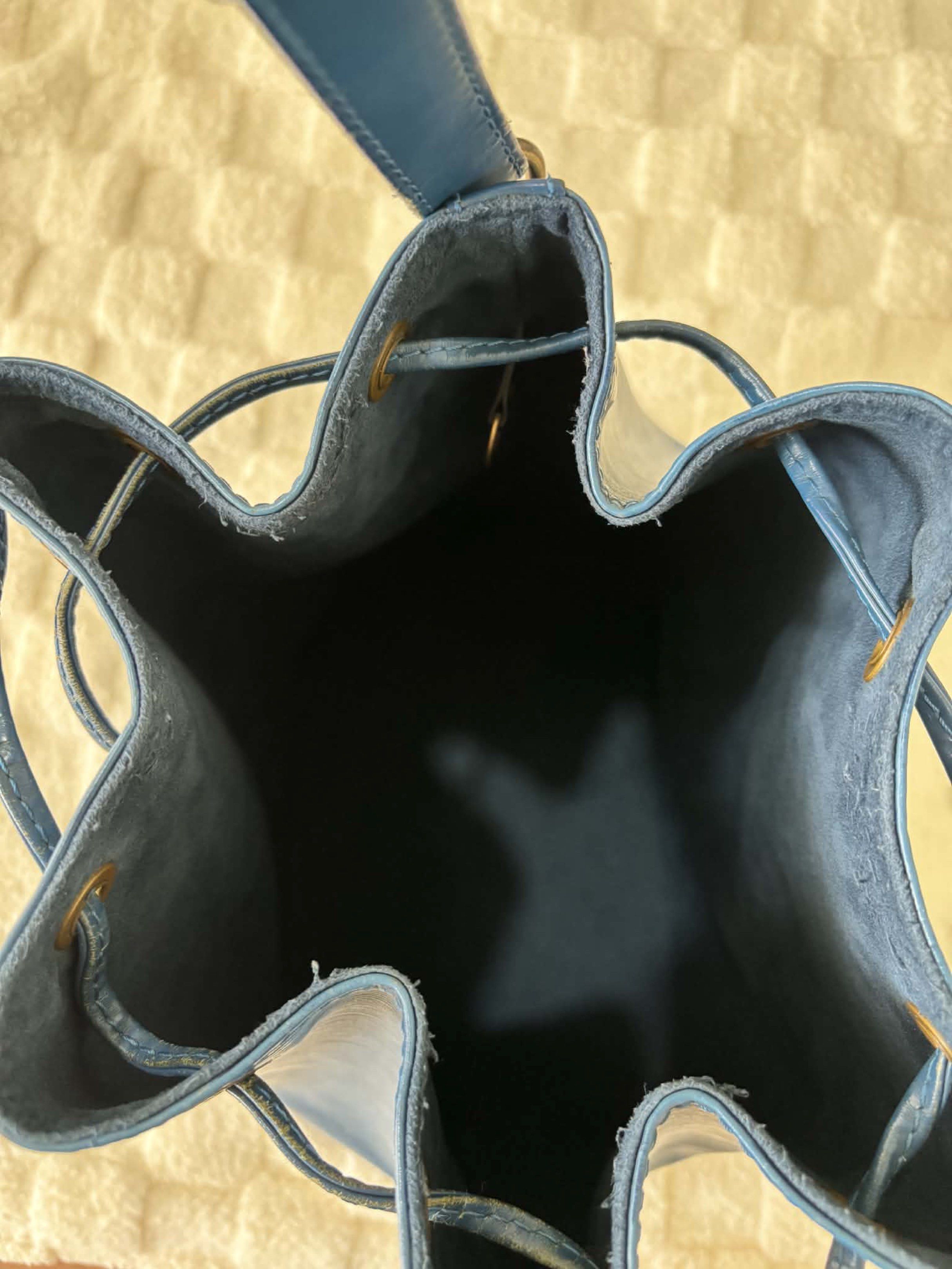 Louis Vuitton Epi Leather Bucket Bag (Category: Luxury Bags & Wallets) located in Makati City. Submitted by selle_personal_decluttering (Listing ID 1420272592, Image 3). Description: Louis Vuitton Epi Noé Bucket Bag – Blue (Authentic, Preloved) Selling my authentic Louis Vuitton Noé in blue Epi leather. A classic, timeless bucket bag with an adjustable shoulder strap. Price: ₱19,000 Details: • Model: Louis Vuitton Noé • Material: Epi leather • Co