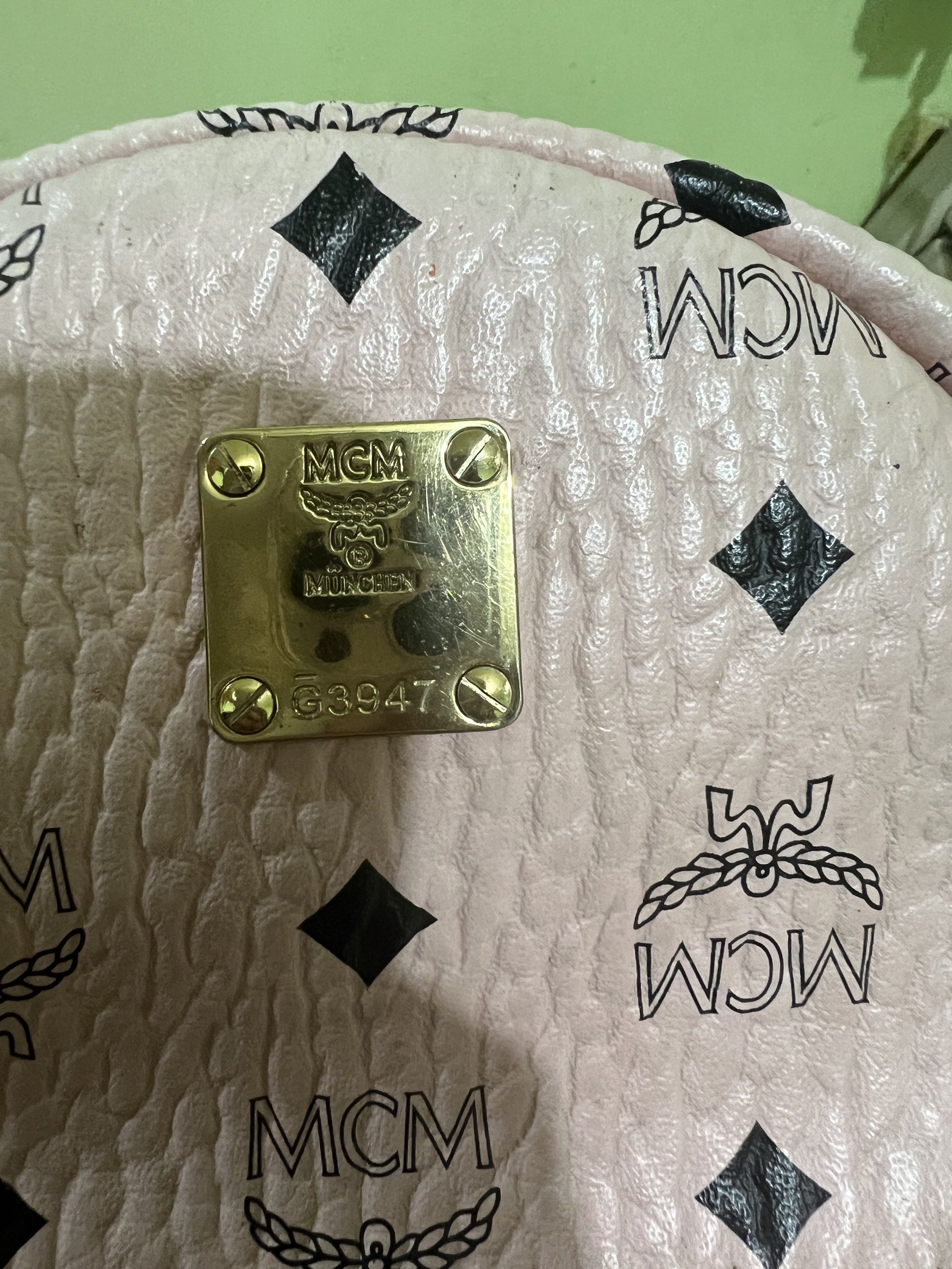 MCM Pink Mini Backpack (Category: Luxury Bags & Wallets) located in Lopez. Submitted by CelestialScent (Listing ID 1420313133, Image 3). Description: Mini Backpack Self authenticate With missing handle in zipper as seen in the photo .