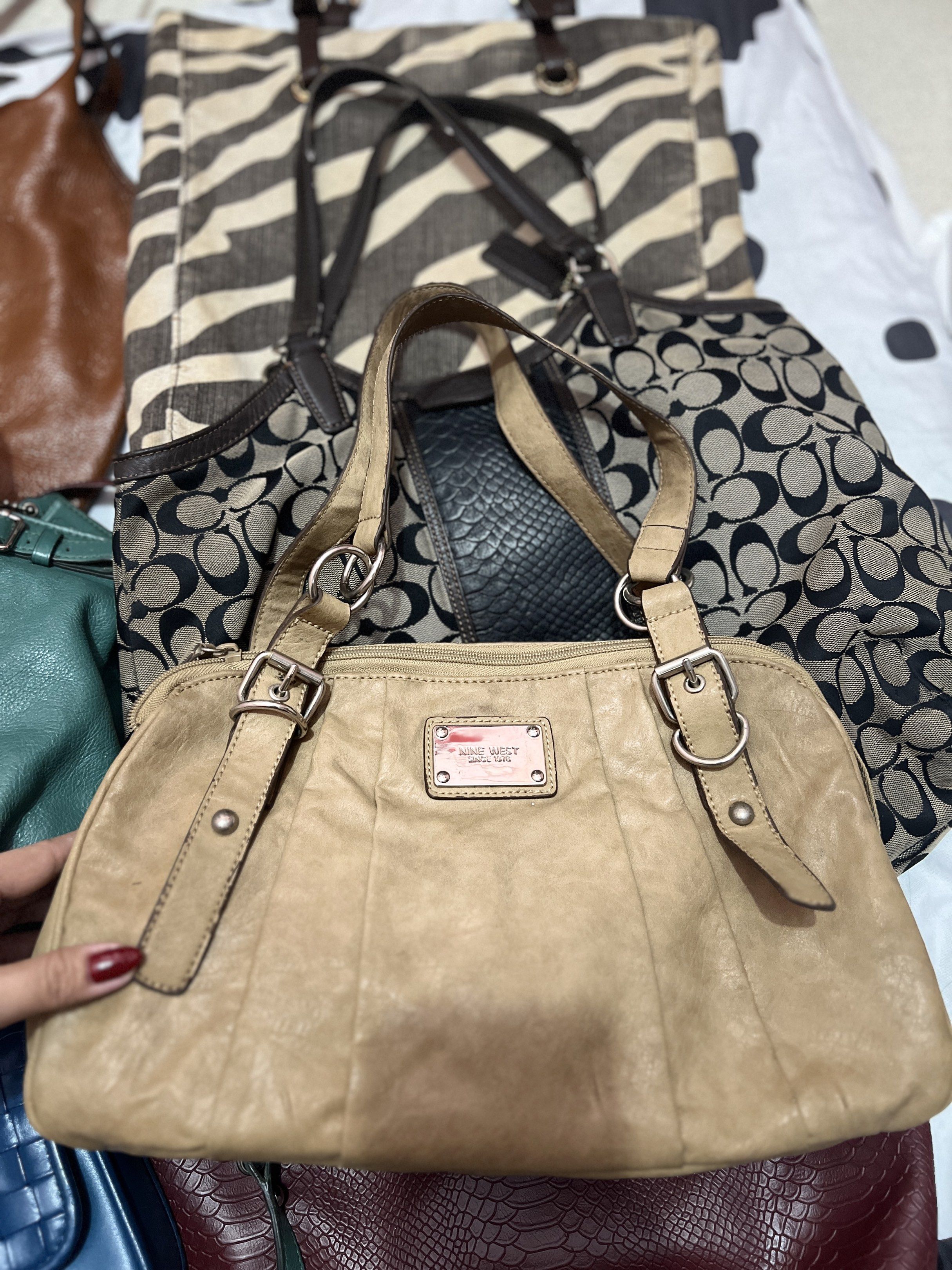 Nine West Beige Handbag (Category: Luxury Bags & Wallets) located in Navotas City. Submitted by declutteringstuff_ph (Listing ID 1420178786, Image 1). Description: - Nine West beige handbag - Rectangular shape - Double handles - Zip closure - Light-colored interior lining - Small interior zip pocket - Exterior metal brand plaque - Silver-tone hardware.