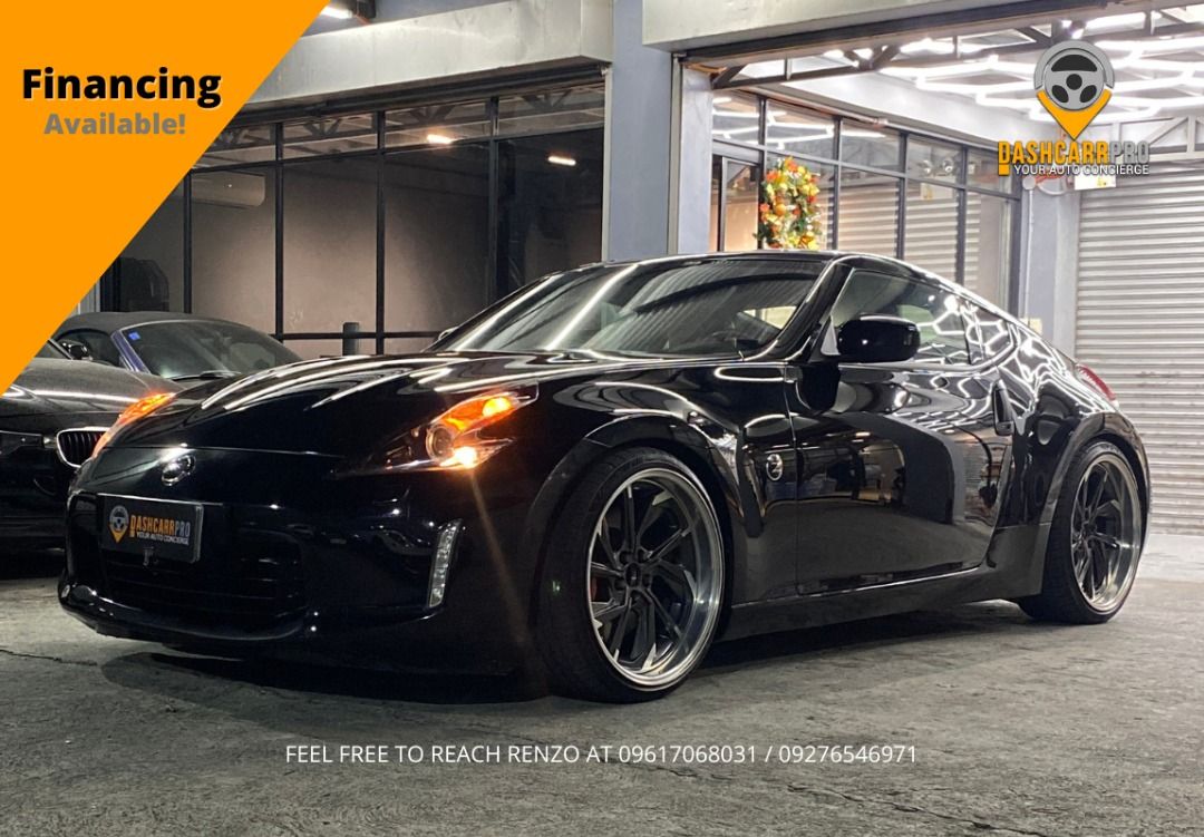 Nissan Fairlady 370z Auto (Category: Used Cars) located in Manila. Submitted by dashcarrpro (Listing ID 1420186134, Image 1). Description: ‼️Financing available‼️ 2021 Nissan Fairlady 370z 🔸Well maintained unit 🔸Automatic transmission 🔸Galaxy Pearl Black 🔸6speed A/T with sport mode 🔸3.7L Engine 🔸RSR Lowering Springs 🔸CRL Full Exhaust 🔸20s Forged Wheels 🔸13k mileage 🔸Bose Sound System 🔸Leather seats 🔸Auto folding side mirrors 🔸Auto di