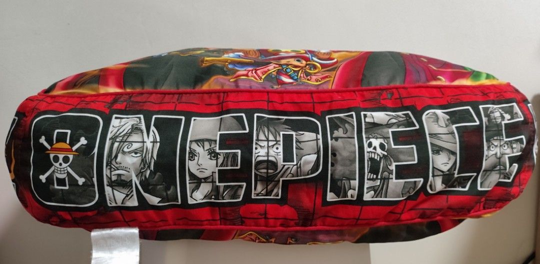 One Piece Film Z Pillow (Category: Bedding & Towels) located in Imus. Submitted by applecheeks_05 (Listing ID 1420282990, Image 2). Description: - One Piece Film Z Pillow - Features a colorful design - Front design: Various characters - Side design: "ONE PIECE" text - Color scheme: Red and black - Material: Fabric - Rectangular shape.