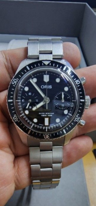 Oris diver sixty-five chronograph monochrome (Category: Luxury Watches) located in Taguig. Submitted by masterbert (Listing ID 1419235274, Image 2). Description: FOR SALE/TRADE - Oris chronograph watch - Stainless steel bracelet - Black dial - Includes original box, booklets, and warranty card - Oris logo on clasp.