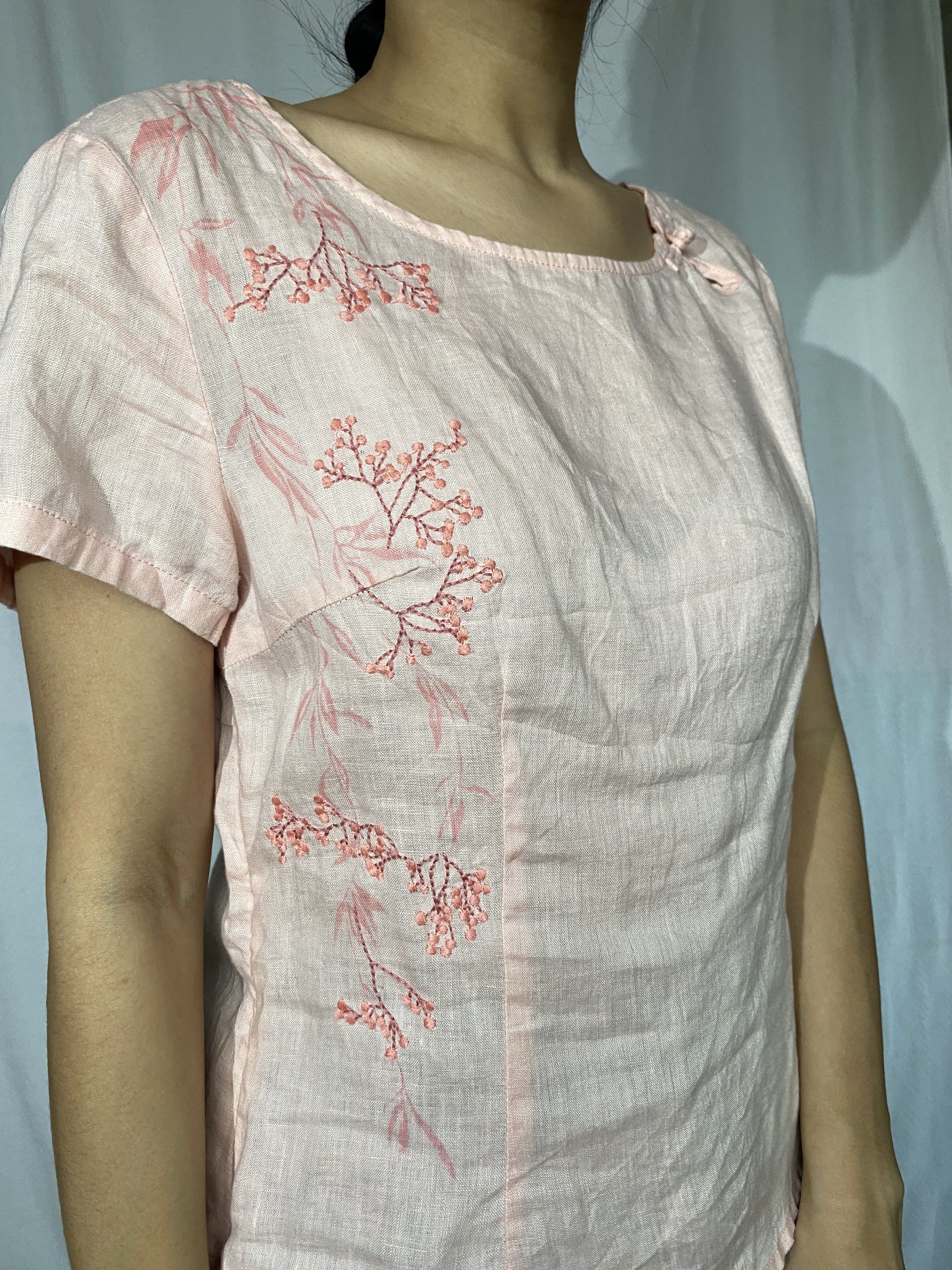 Pink Embroidered Linen Topwith chinese frog button (Category: Sleeveless) located in Tarlac. Submitted by himesells (Listing ID 1420242450, Image 2). Description: - Pink embroidered top - Short sleeves - Round neckline - Side zipper - Linen material - Features a small bow detail - Perfect for a casual, feminine look.