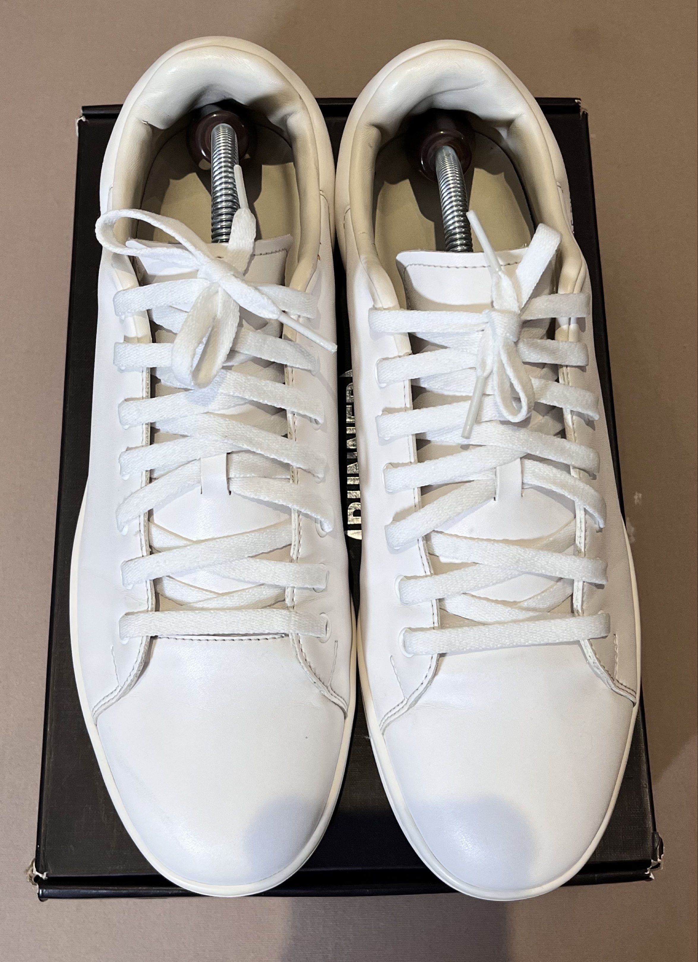 Raf Simons Runner Sneakers (Category: Sneakers) located in Makati City. Submitted by leejungsu.thecuratedrack (Listing ID 1420317688, Image 1). Description: White Raf Simons Runner sneakers. The sneakers are white with white laces. The box is included. The box has the Raf Simons Runner logo on it. Size 45/11 mens. (Yellowing Sole) Srp ₱ 12,998.