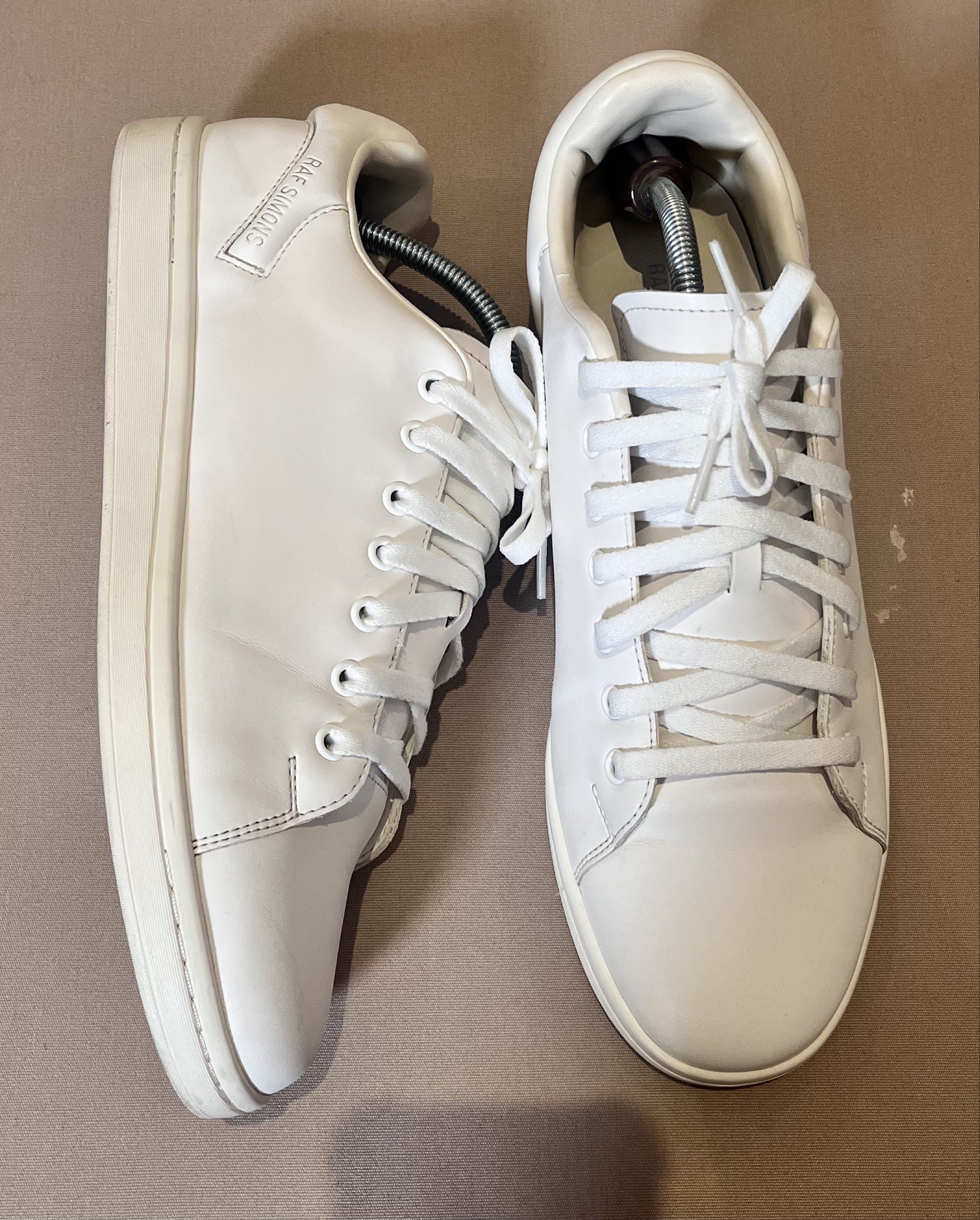 Raf Simons Runner Sneakers (Category: Sneakers) located in Makati City. Submitted by leejungsu.thecuratedrack (Listing ID 1420317688, Image 3). Description: White Raf Simons Runner sneakers. The sneakers are white with white laces. The box is included. The box has the Raf Simons Runner logo on it. Size 45/11 mens. (Yellowing Sole) Srp ₱ 12,998.