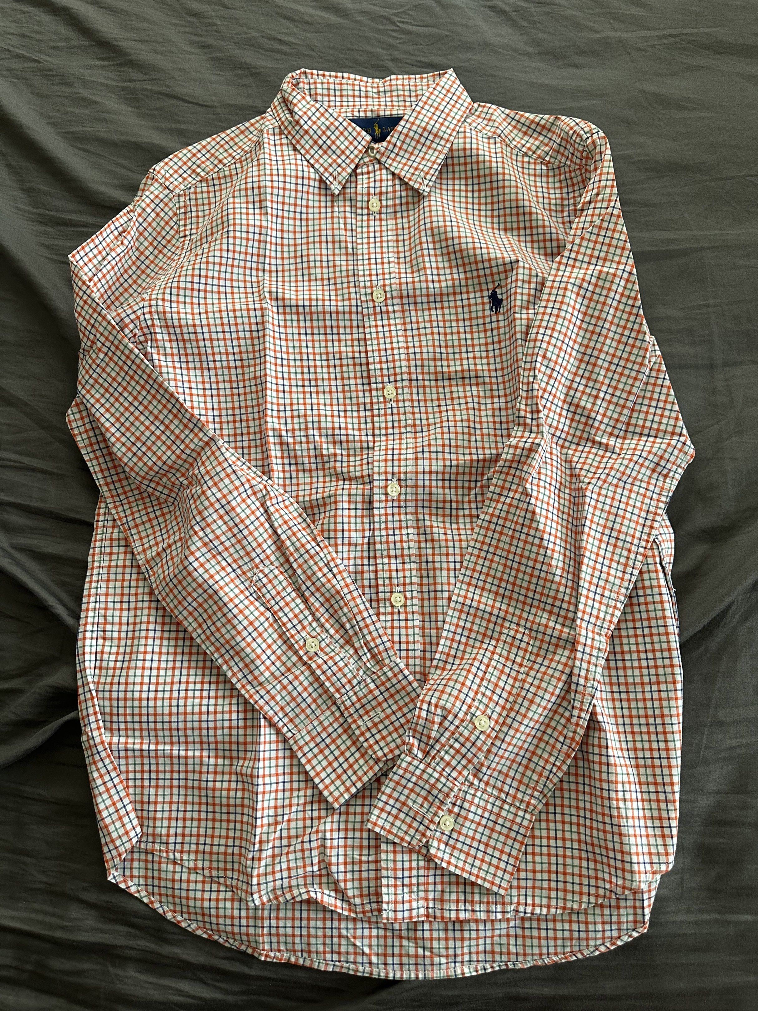 Ralph Lauren Checkered Long Sleeve Shirt (Category: Tshirts & Polo Shirts ) located in Pasig City. Submitted by chiccochoco (Listing ID 1420168942, Image 1). Description: - Ralph Lauren long sleeve shirt - Classic checkered pattern (red, blue, white) - Button-down collar - Embroidered logo on chest - Long sleeves with buttoned cuffs - Lightweight fabric - Perfect for casual wear.